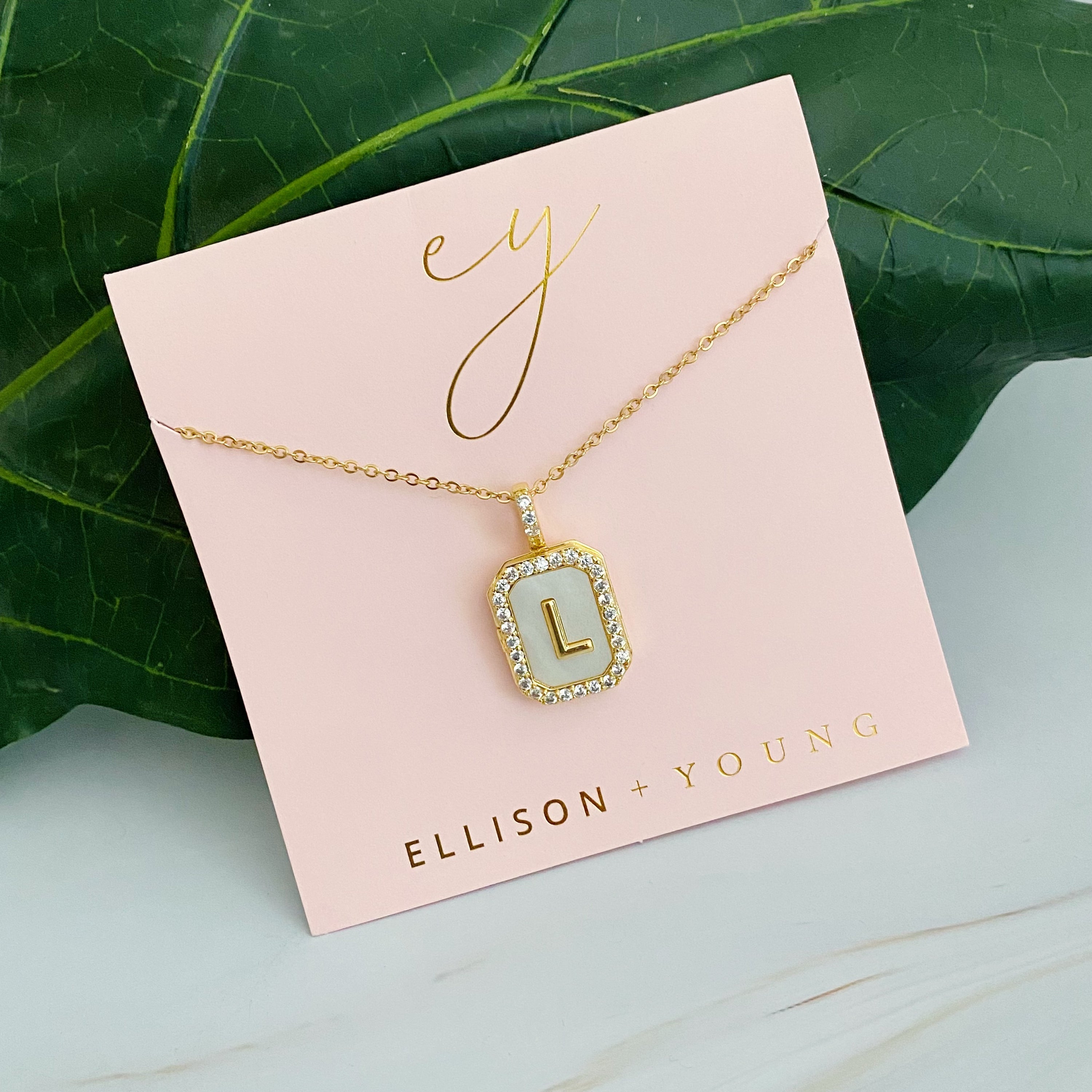 Initial Deco Open Locket Pendant Necklace featuring mother of pearl and cubic zirconia, octagon shape with customizable initial.