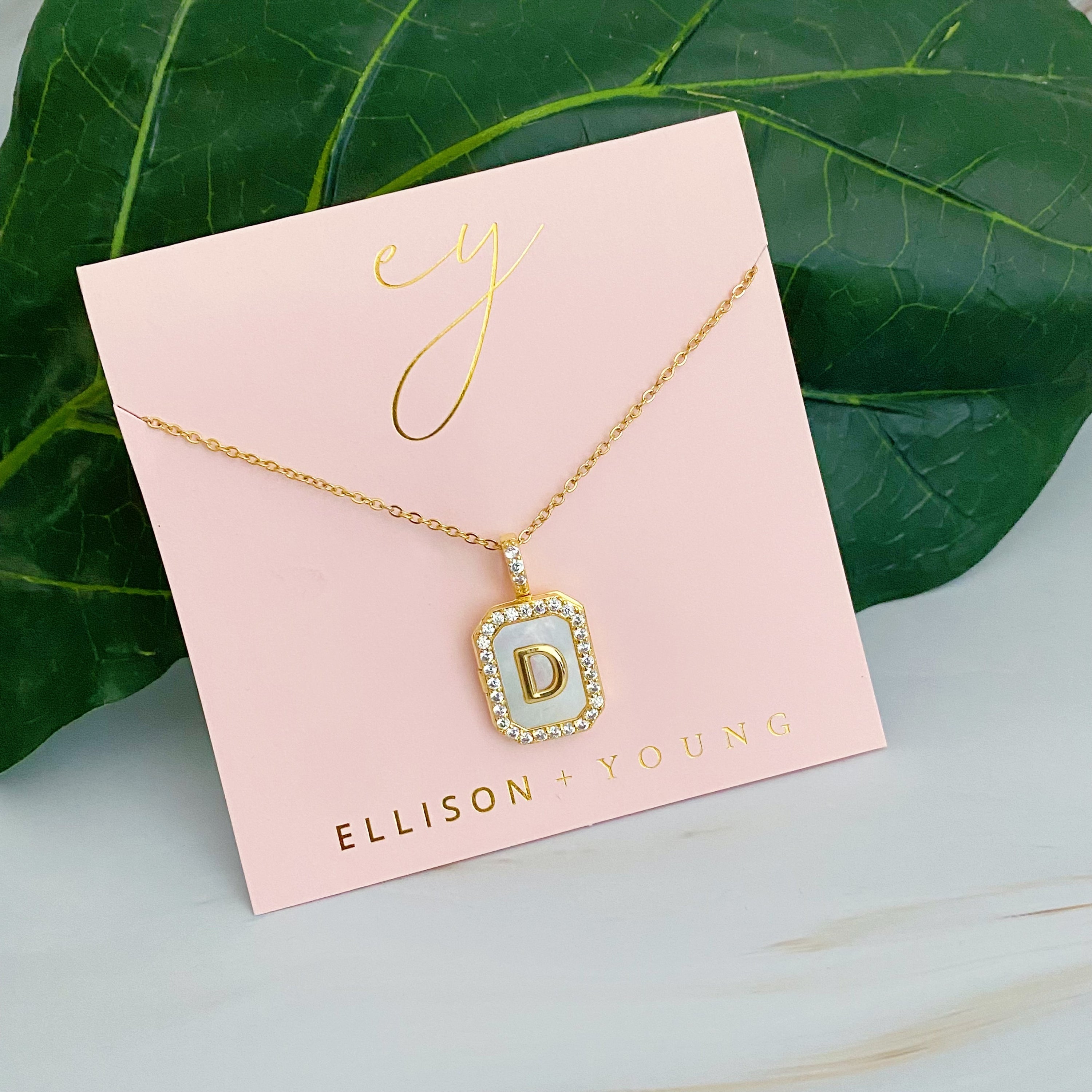 Initial Deco Open Locket Pendant Necklace featuring mother of pearl and cubic zirconia, octagon shape with customizable initial.