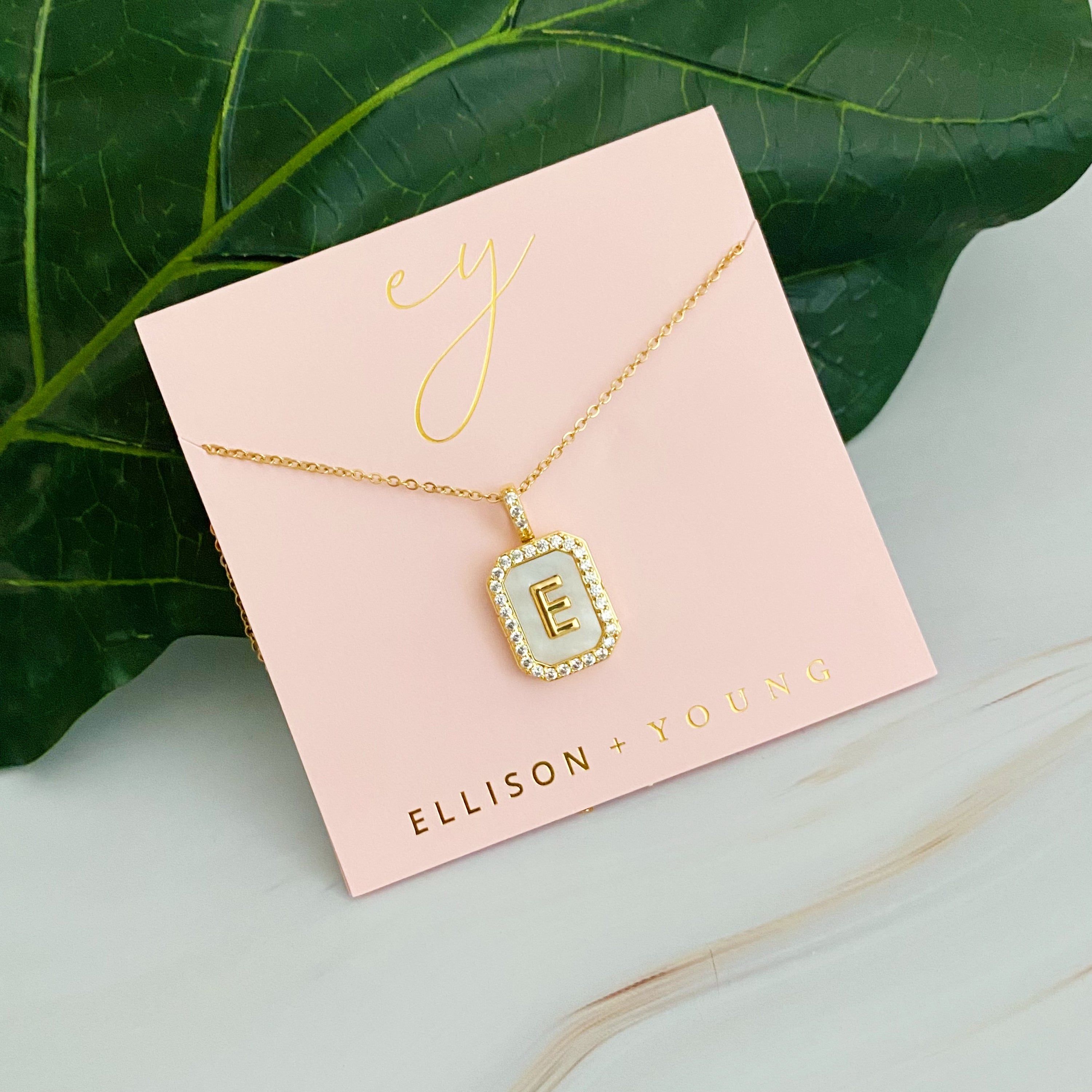 Initial Deco Open Locket Pendant Necklace featuring mother of pearl and cubic zirconia, octagon shape with customizable initial.