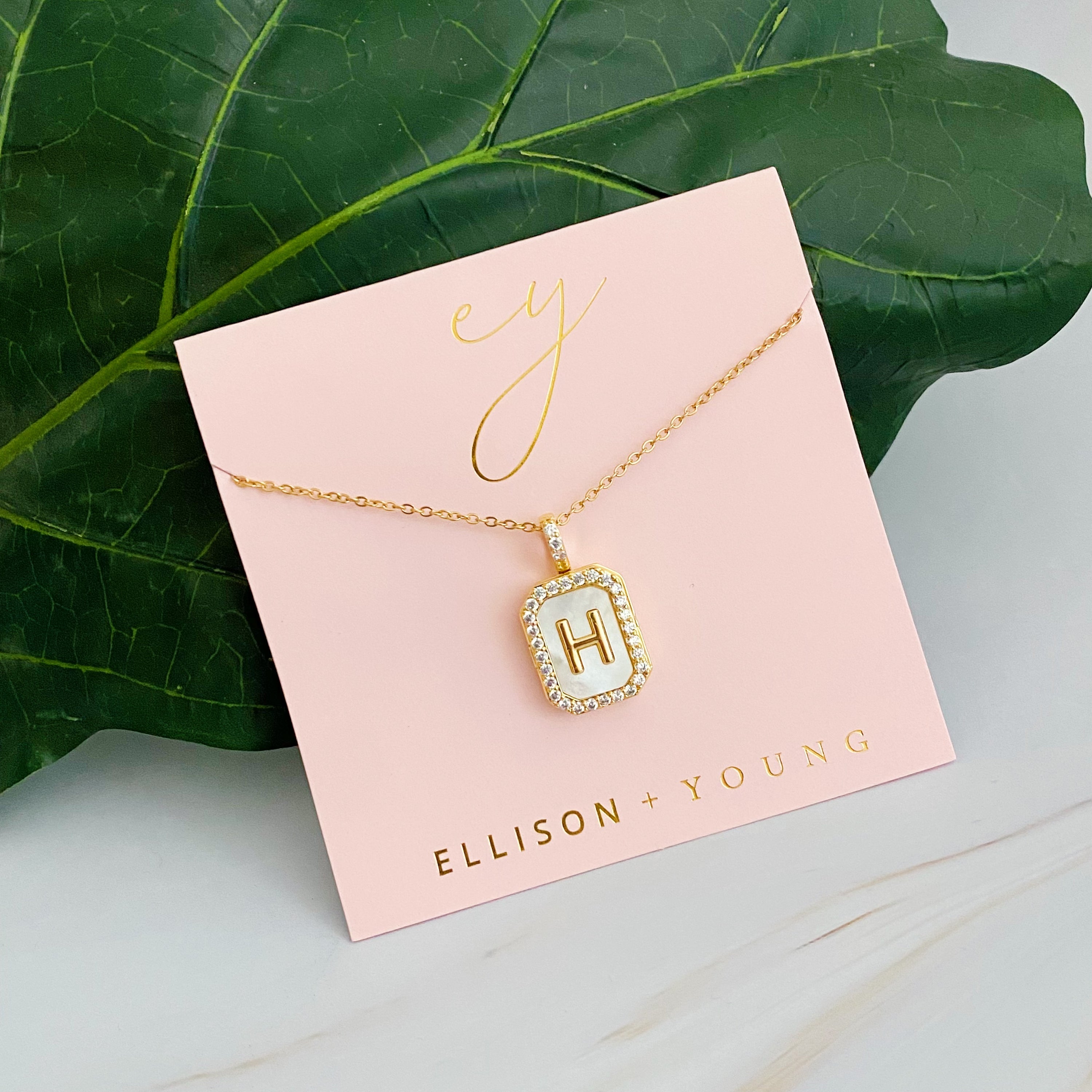 Initial Deco Open Locket Pendant Necklace featuring mother of pearl and cubic zirconia, octagon shape with customizable initial.