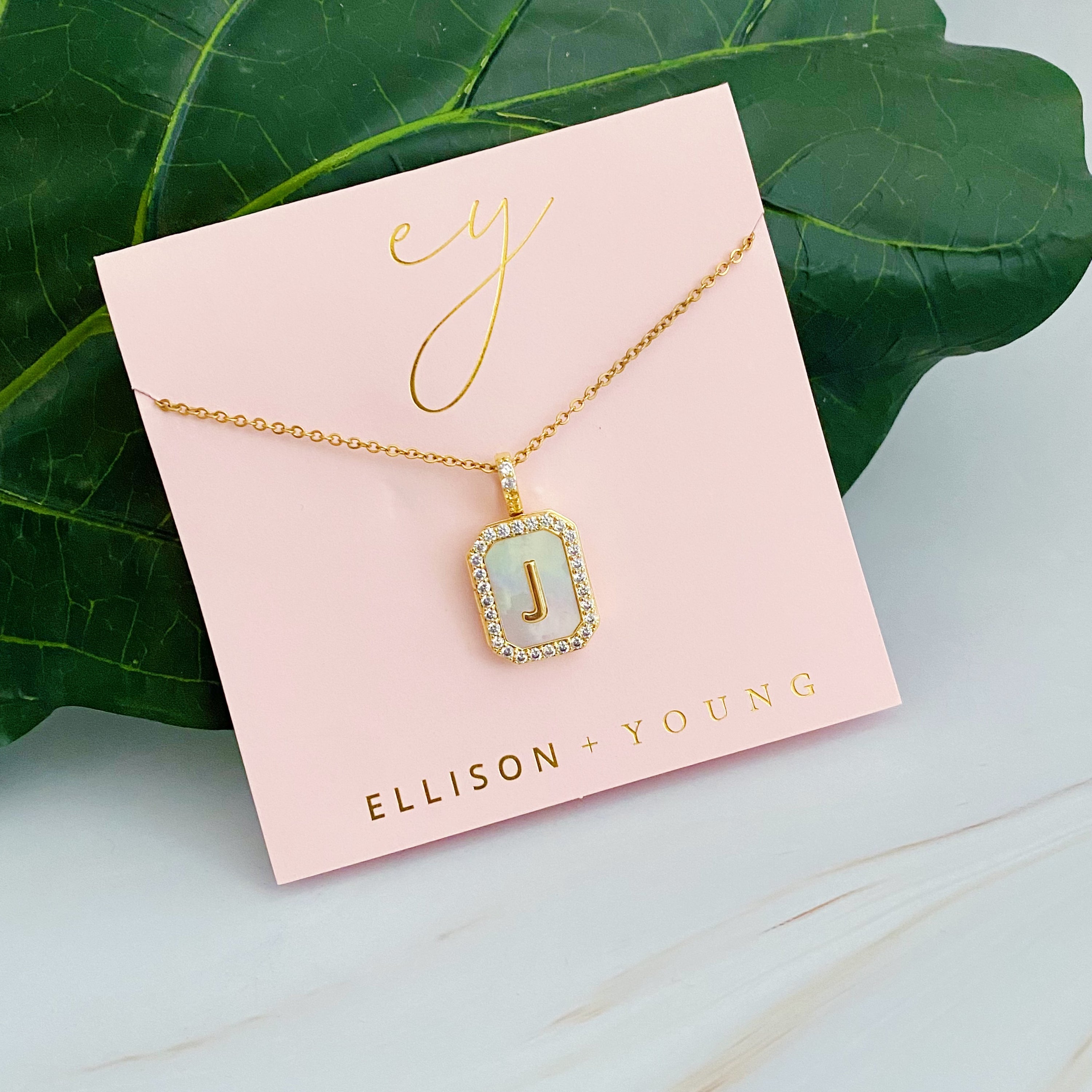 Initial Deco Open Locket Pendant Necklace featuring mother of pearl and cubic zirconia, octagon shape with customizable initial.