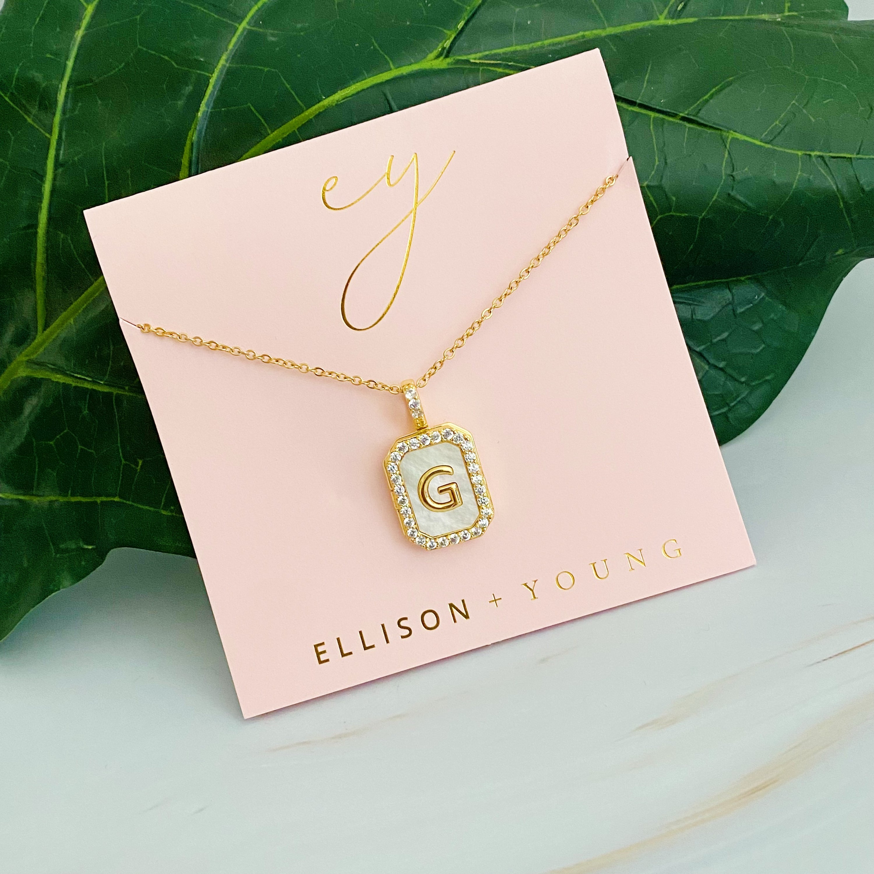 Initial Deco Open Locket Pendant Necklace featuring mother of pearl and cubic zirconia, octagon shape with customizable initial.