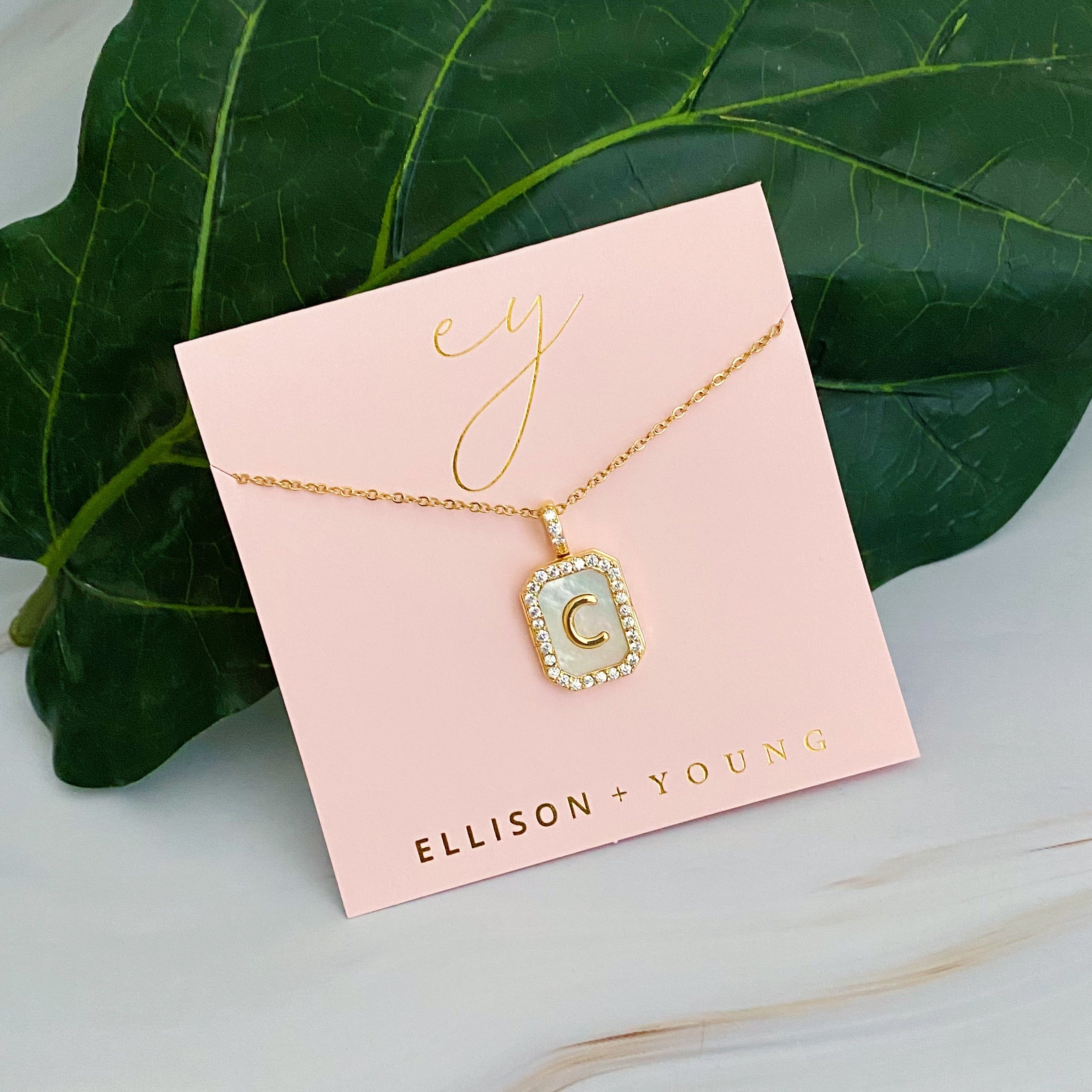 Initial Deco Open Locket Pendant Necklace featuring mother of pearl and cubic zirconia, octagon shape with customizable initial.