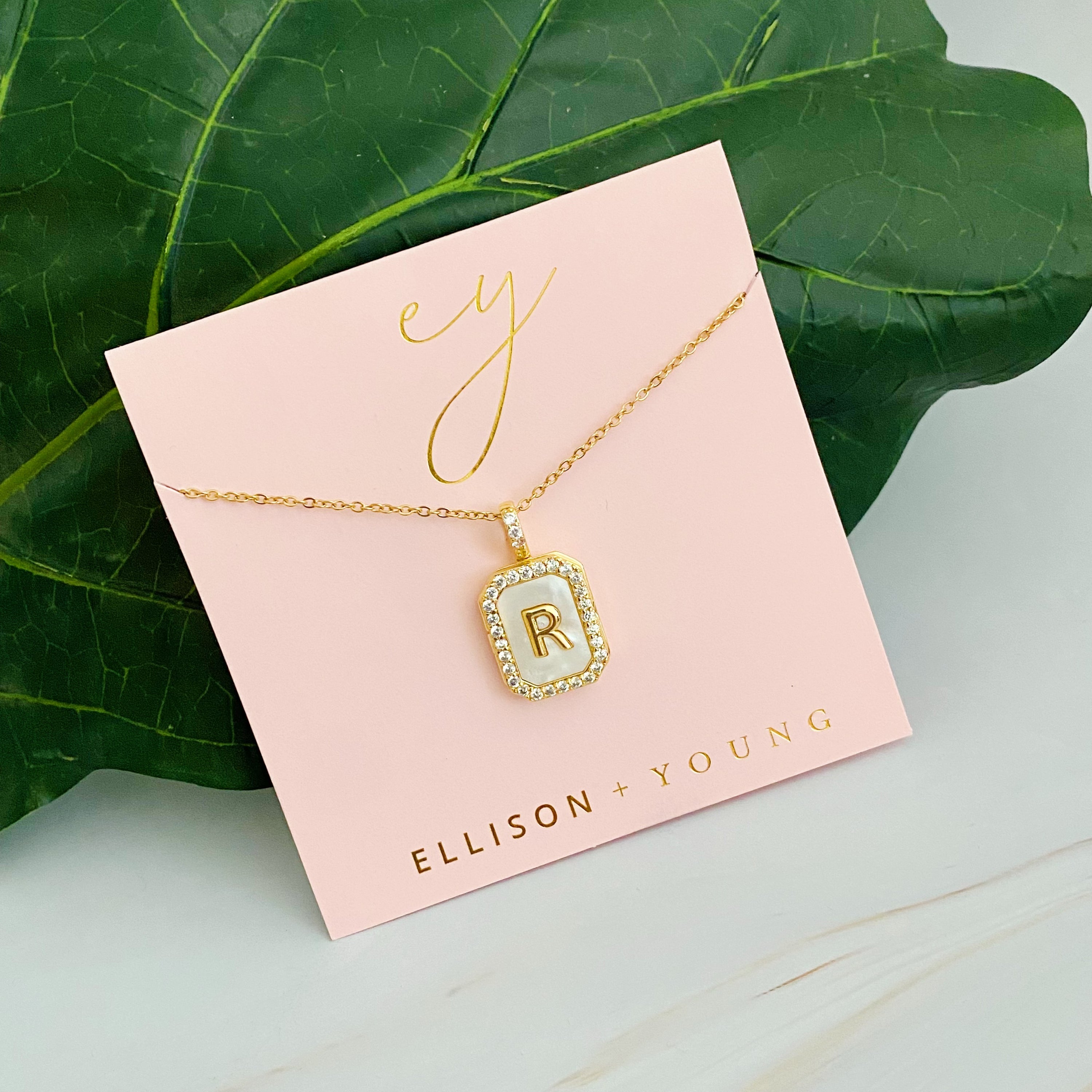 Initial Deco Open Locket Pendant Necklace featuring mother of pearl and cubic zirconia, octagon shape with customizable initial.