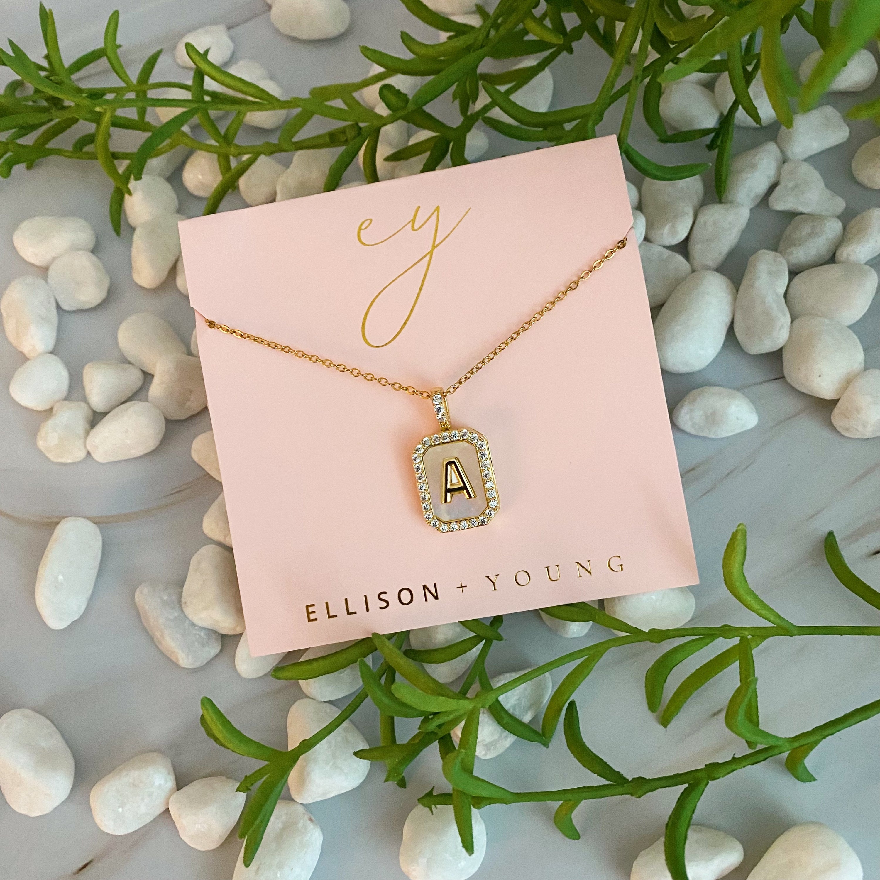 Initial Deco Open Locket Pendant Necklace featuring mother of pearl and cubic zirconia, octagon shape with customizable initial.