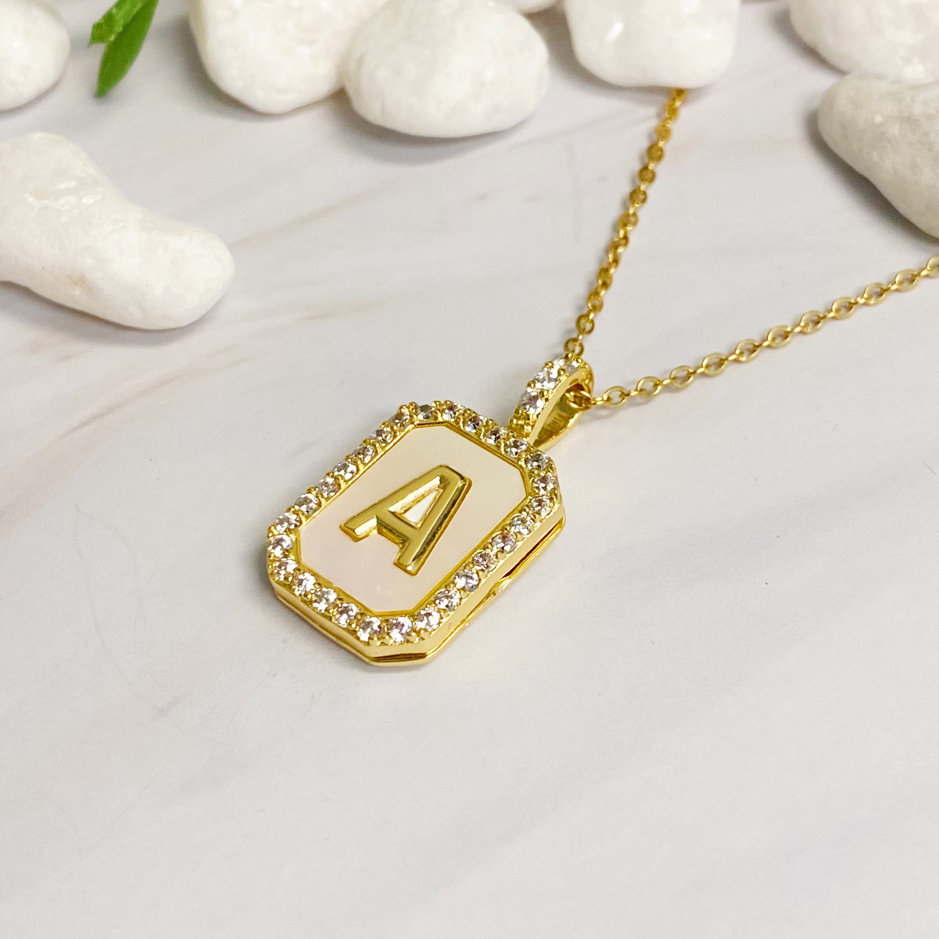 Initial Deco Open Locket Pendant Necklace featuring mother of pearl and cubic zirconia, octagon shape with customizable initial.