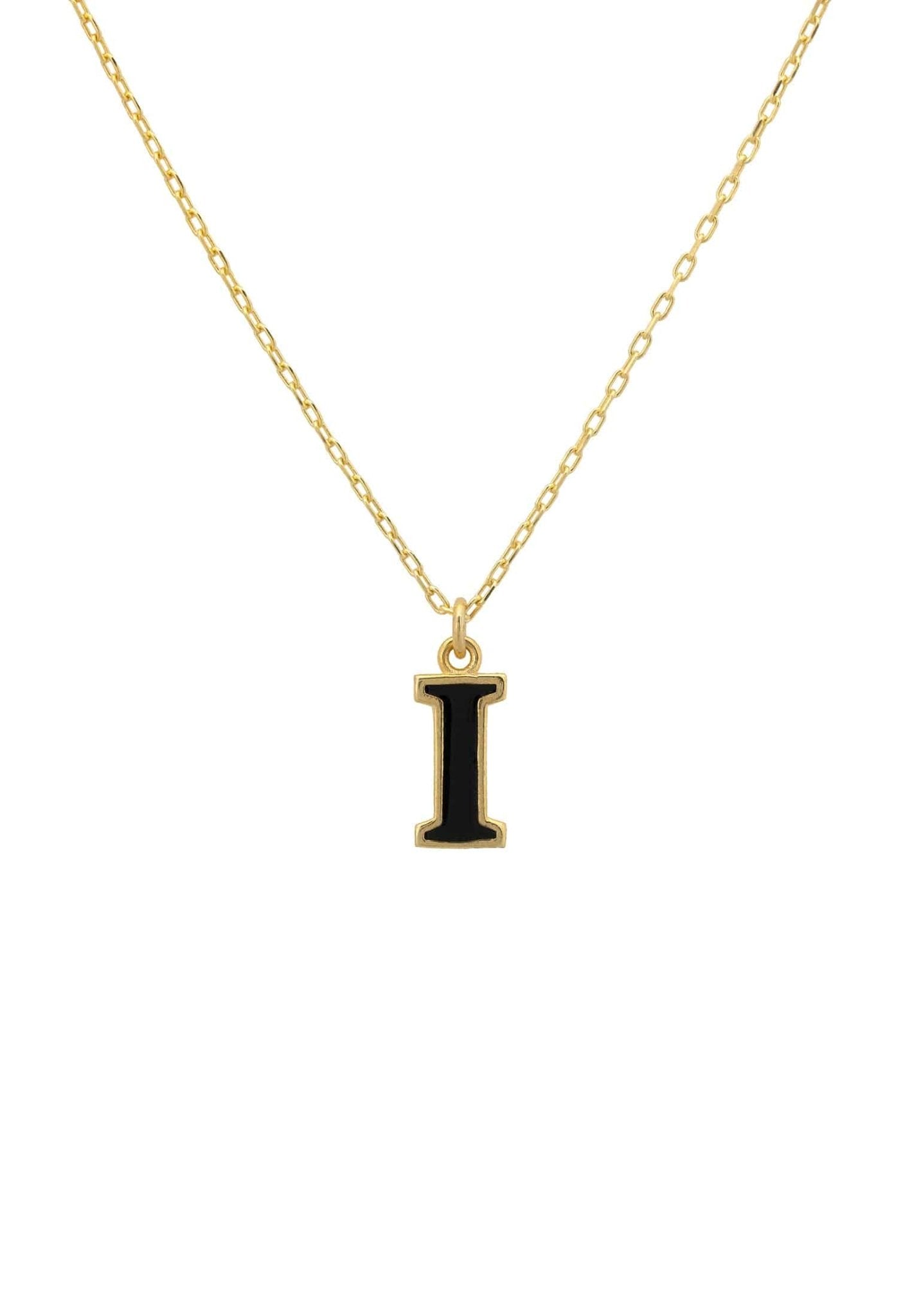 A delicate gold initial enamel necklace featuring a black enamel inlay, elegantly displayed in a signature jewellery box.