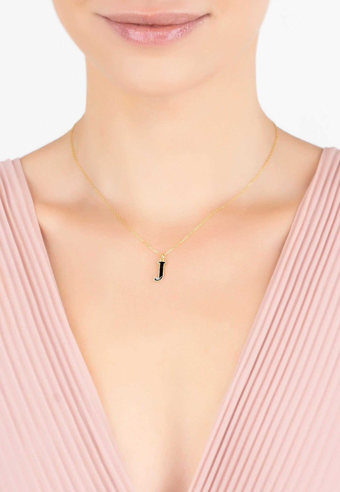 Initial Enamel Necklace Gold J featuring a black enamel inlay and 22ct gold dipped sterling silver setting.