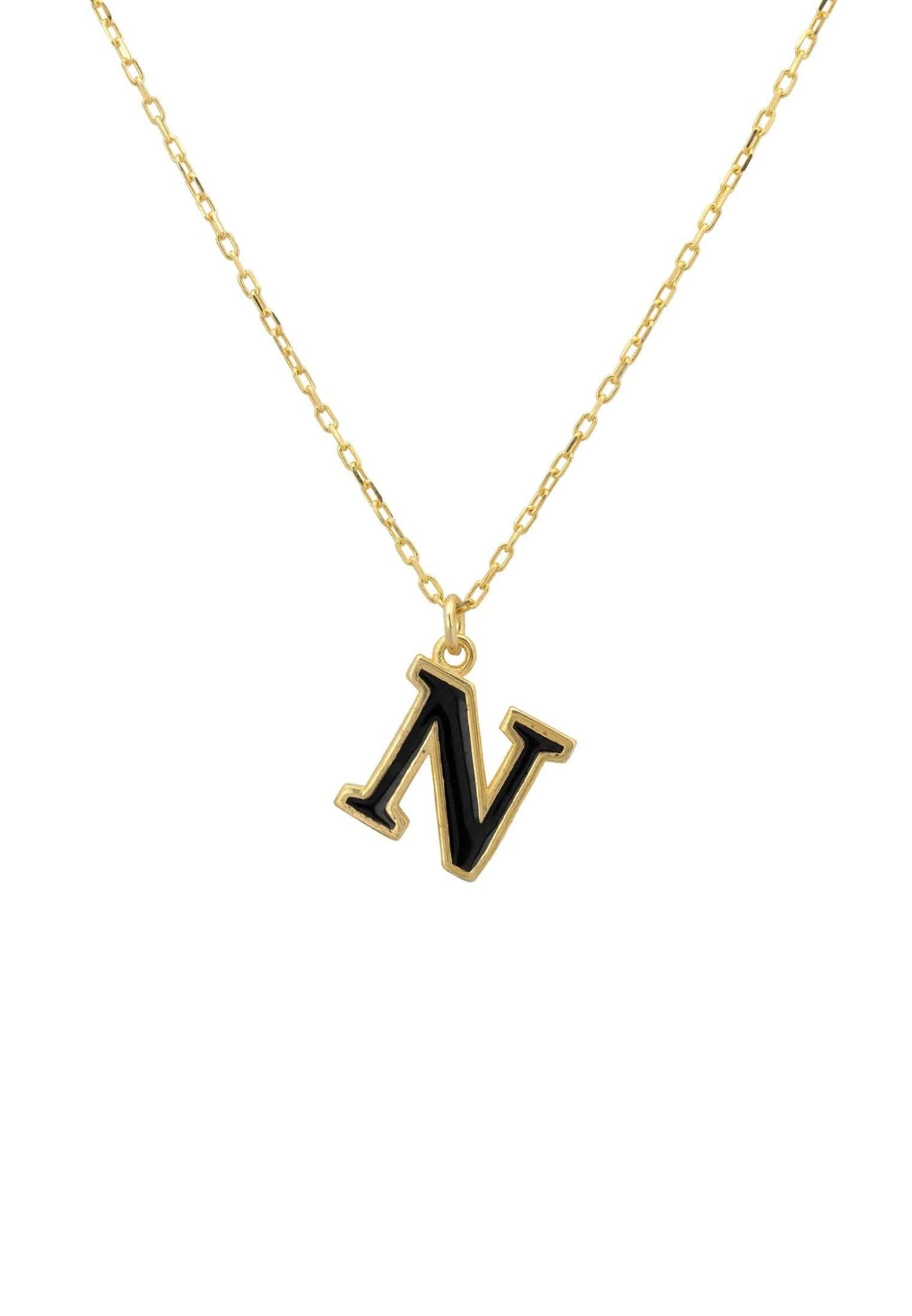 A delicate gold initial enamel necklace featuring a black enamel inlay, elegantly displayed in a jewelry box.