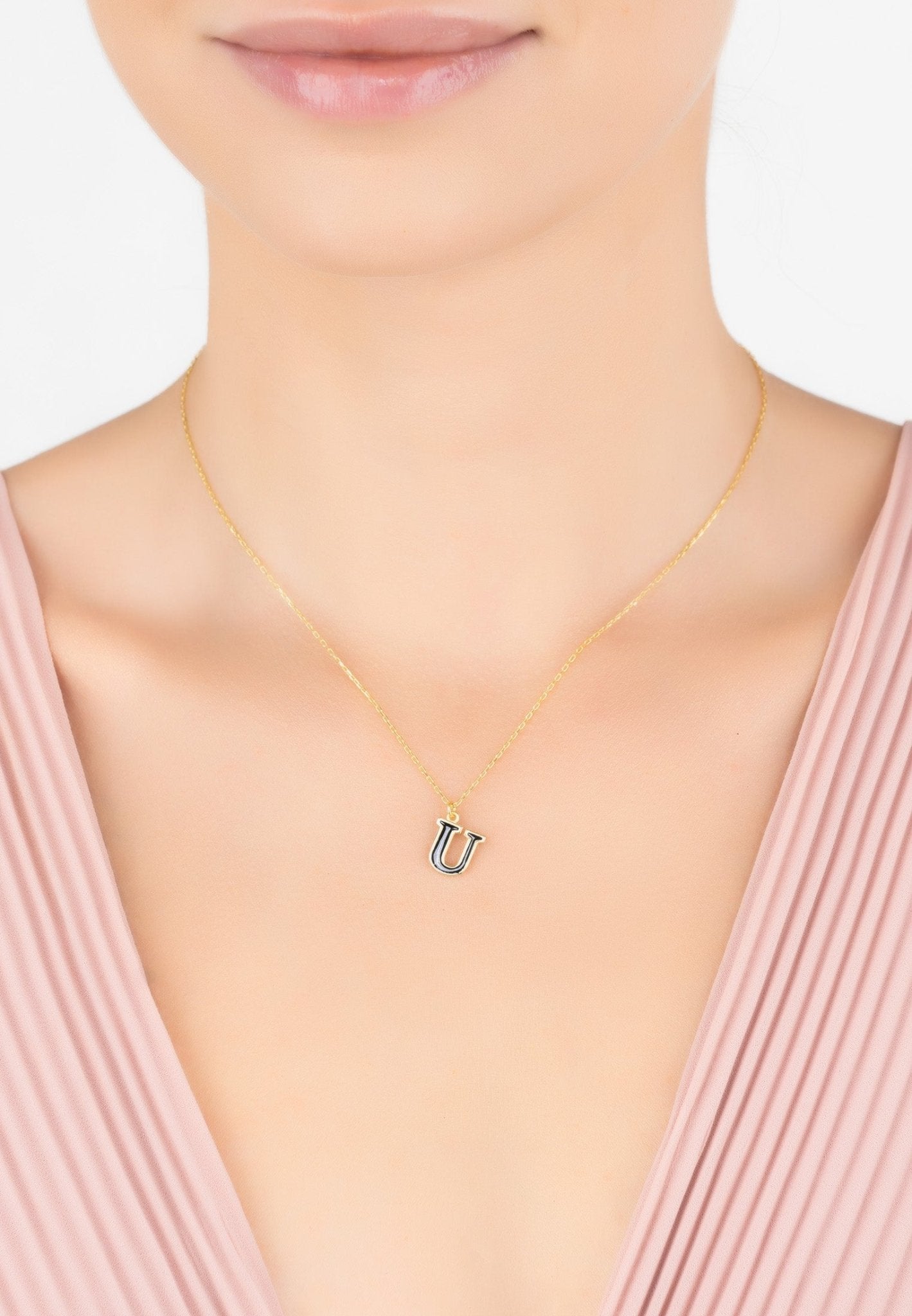 Elegant Initial Enamel Necklace Gold U featuring a black enamel inlay and 22ct gold finish, perfect for personalizing your style.