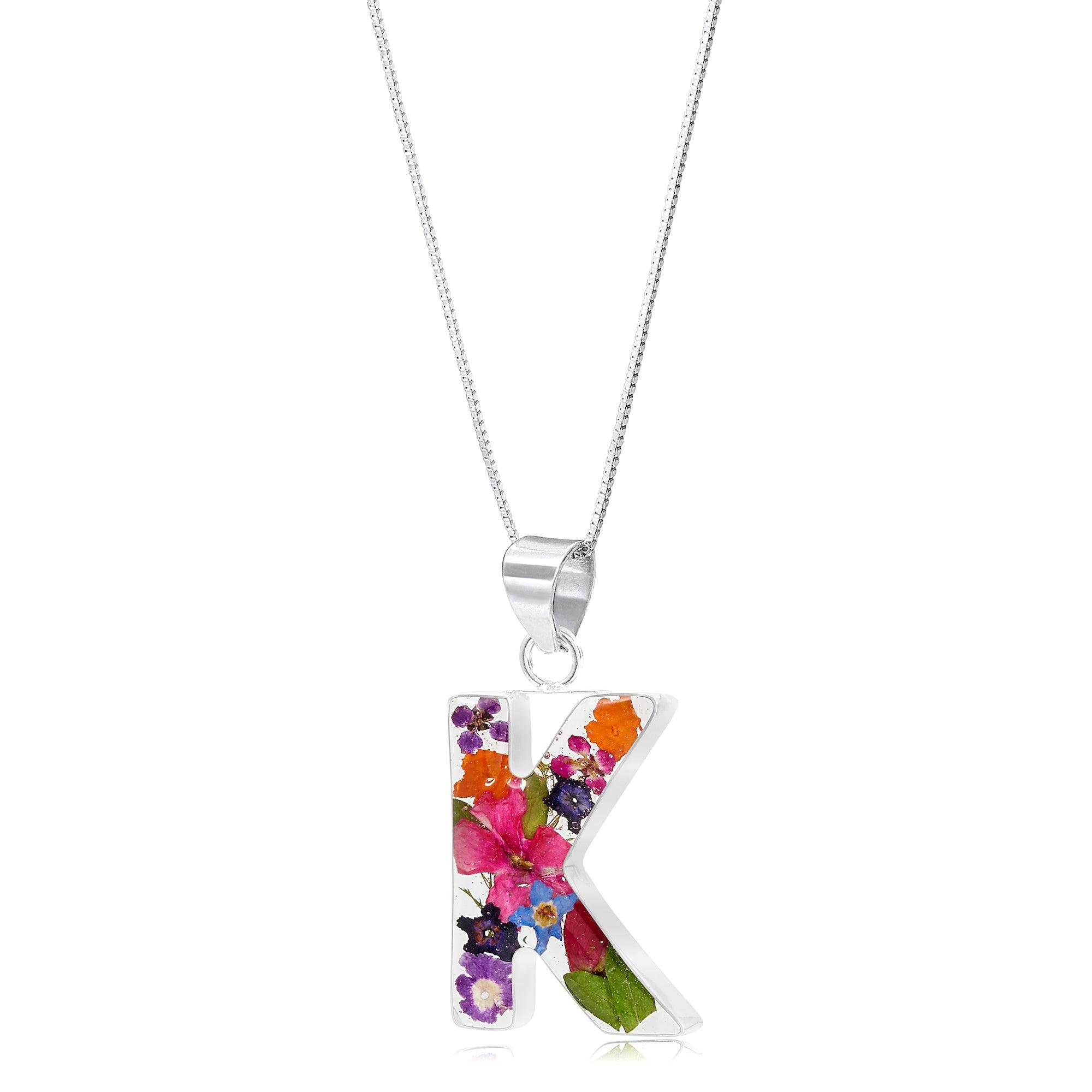 Handmade sterling silver initial necklace with real flowers, featuring an adjustable chain and stylish gift box.