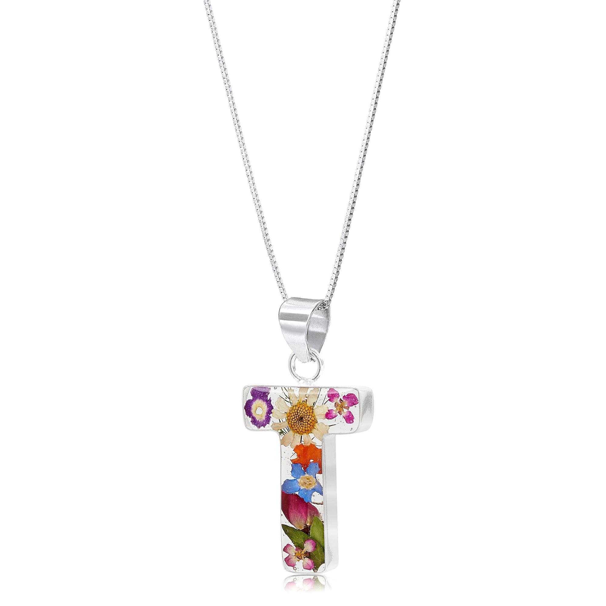 Handmade sterling silver initial necklace with real flowers, featuring an adjustable chain and stylish gift box.