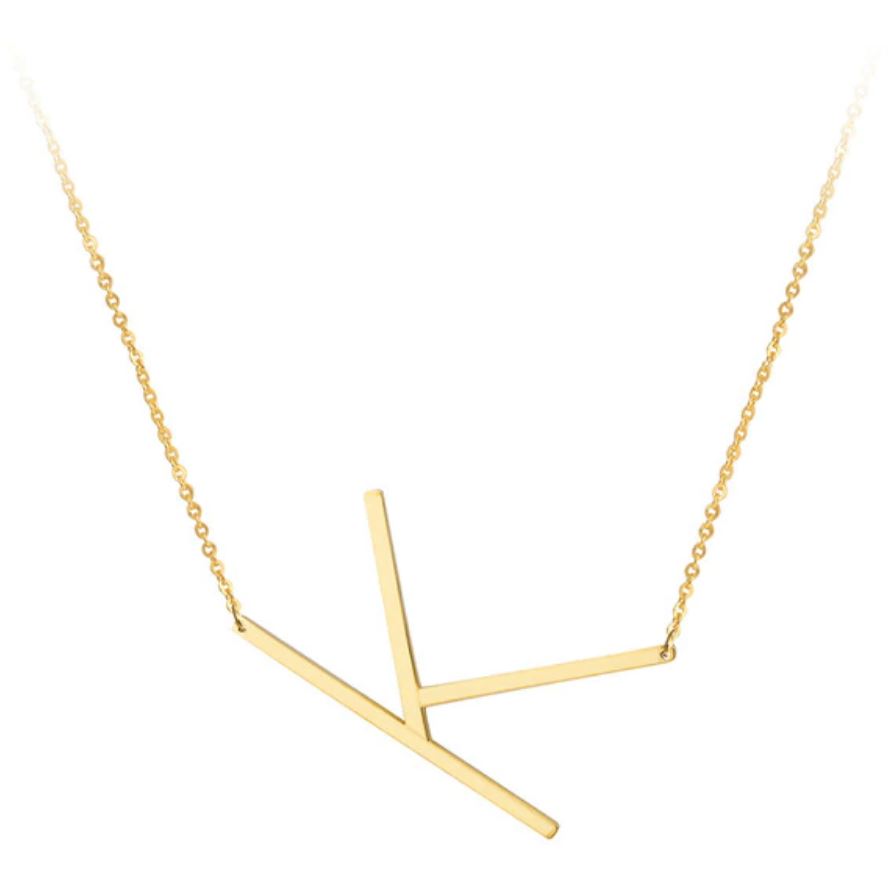 A large initial necklace featuring a polished gold tone finish, showcasing a customizable block letter design.