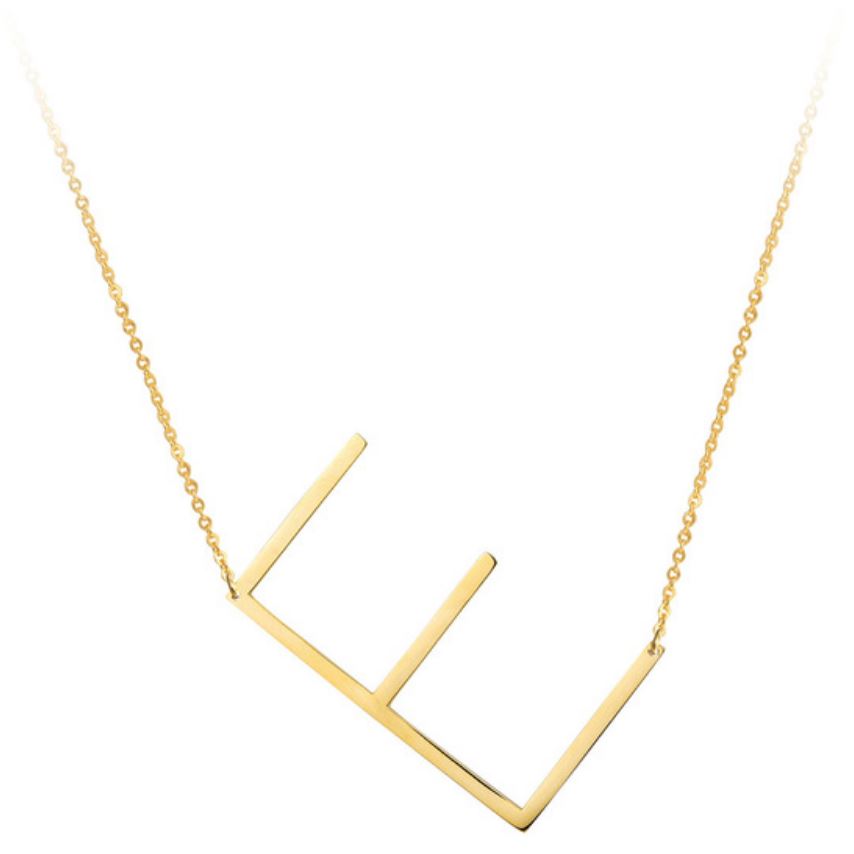 A large initial necklace featuring a polished gold tone finish, showcasing a customizable block letter design.