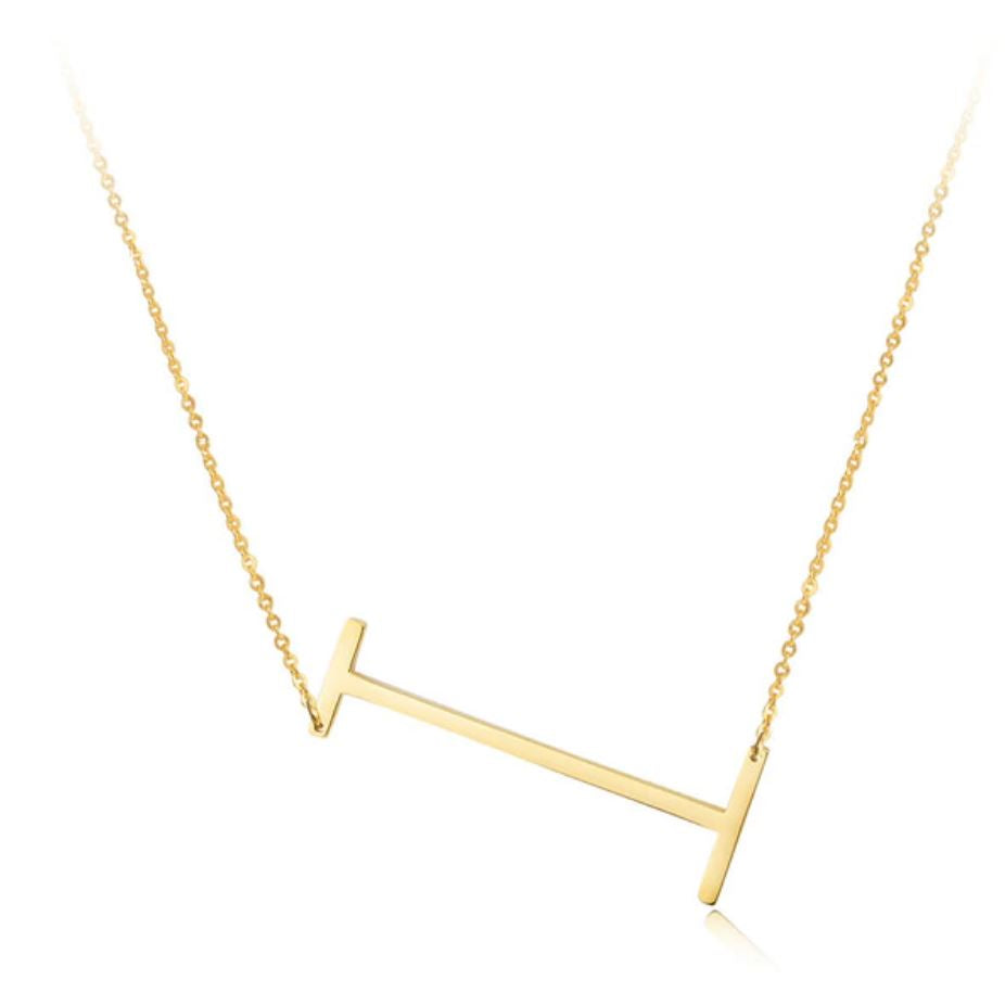 A large initial necklace featuring a polished gold tone finish, showcasing a customizable block letter design.