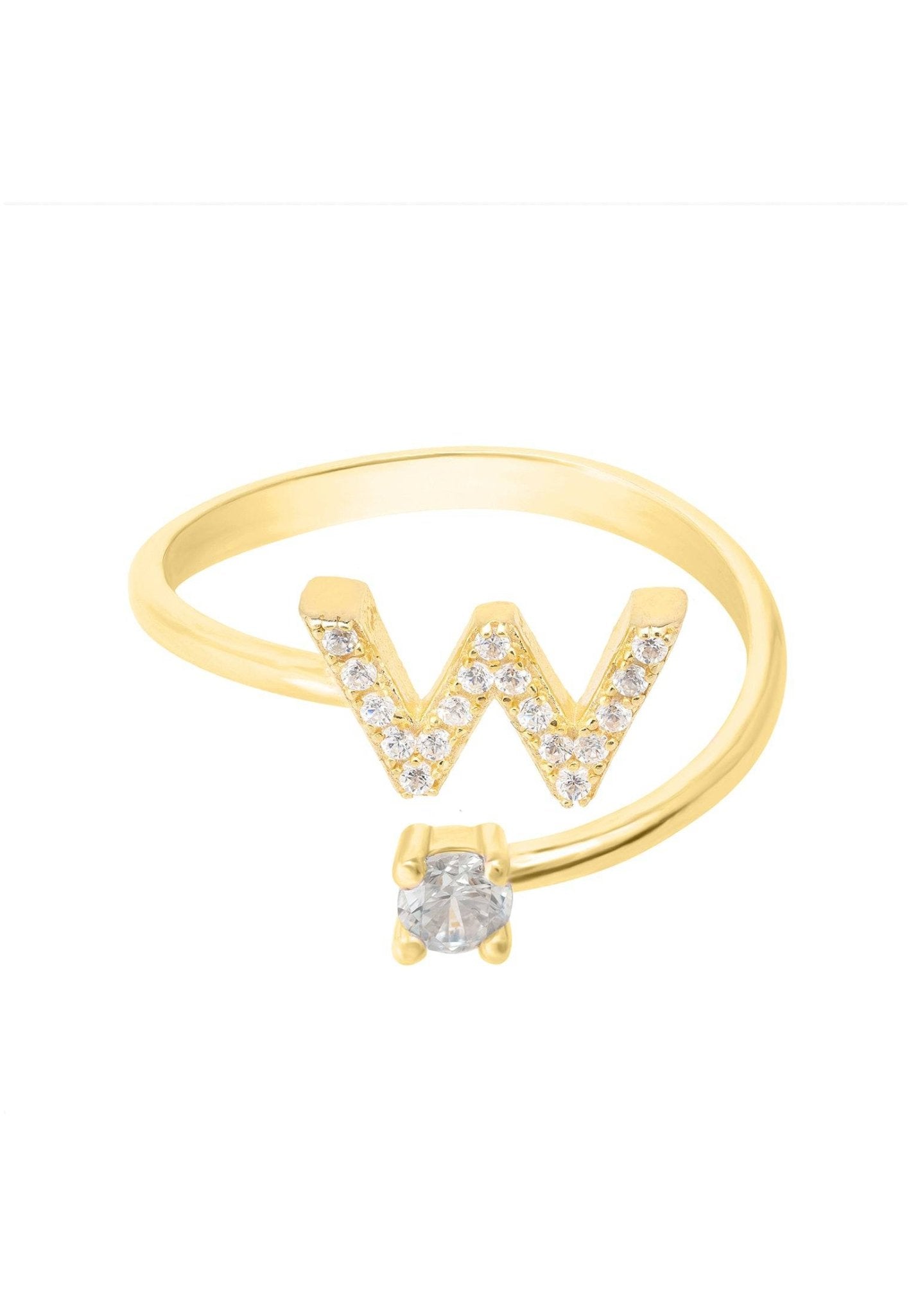 A delicate gold initial ring featuring cubic zirconia accents, elegantly displayed in a jewelry box.