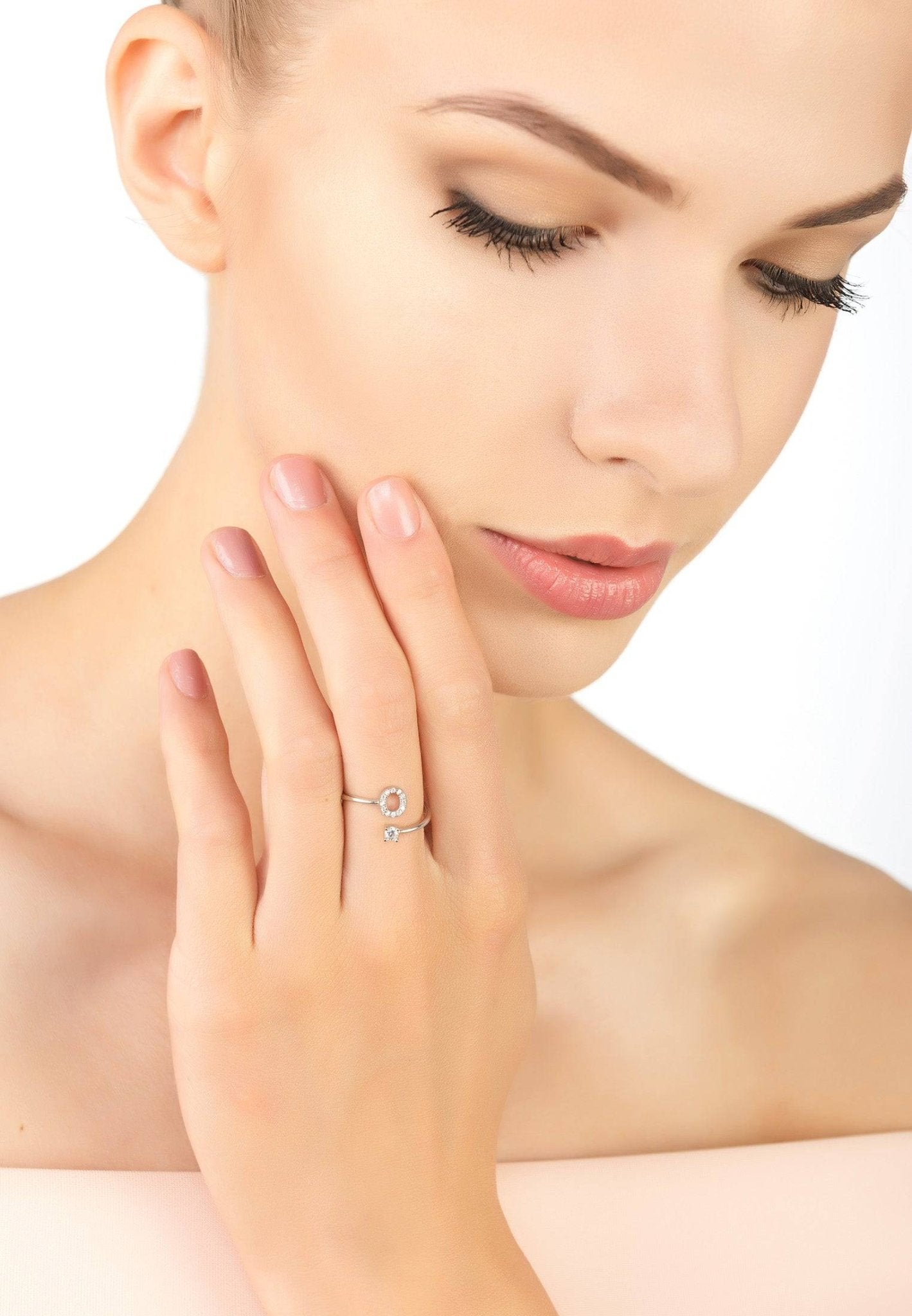 A delicate Initial Ring Silver O made of 925 sterling silver with cubic zirconia, featuring an adjustable open band design.