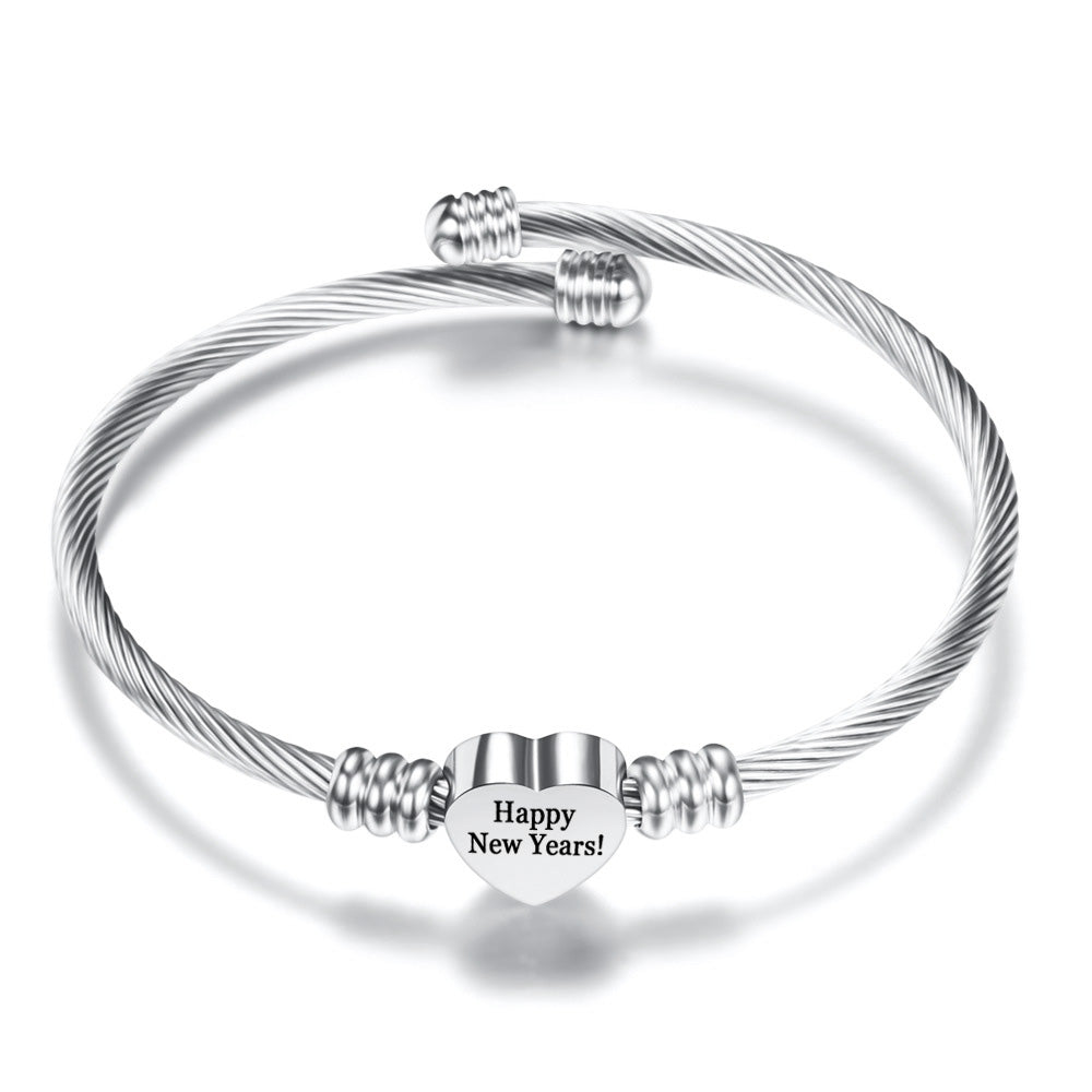 Inspirational Quotes Stainless Steel Heart Charm Bangle with 27 options, showcasing a heart charm and elegant design.