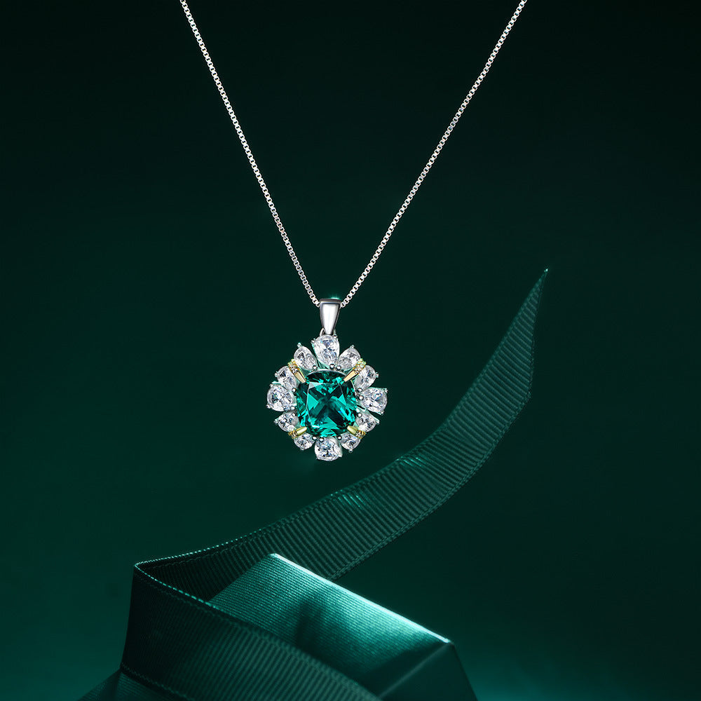 A stunning Green Forest-inspired necklace made of 925 sterling silver, featuring emerald and white sapphire stones, elegantly designed for a luxurious look.