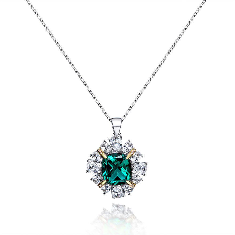 A stunning Green Forest-inspired necklace made of 925 sterling silver, featuring emerald and white sapphire stones, elegantly designed for a luxurious look.