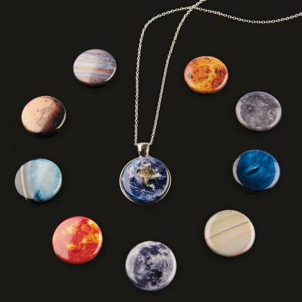 Interchangeable Solar System Necklace featuring 8 planets, the Moon, and the Sun on a silver or bronze chain, showcasing a unique travel jewelry design.