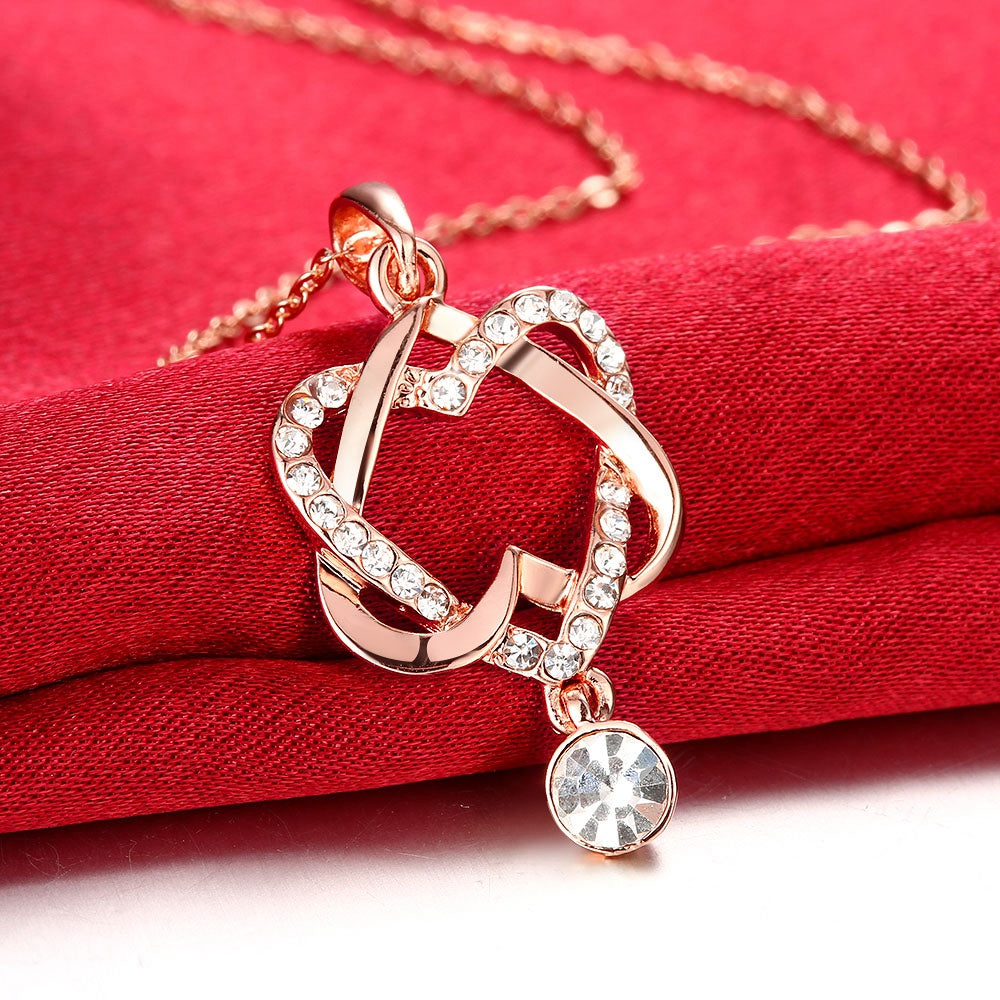 Intertwined Heart Necklace in 18K Rose Gold Plated with Crystals, elegantly designed and presented in a white gift box.