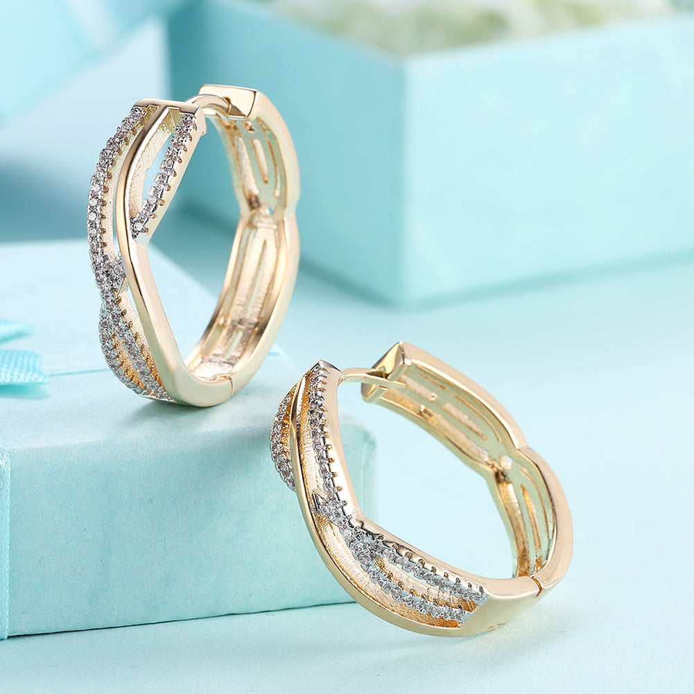 Intertwined Inception Twist 0.90" Hoop Earring in 18K Gold Plated, showcasing its elegant design and luxurious finish.