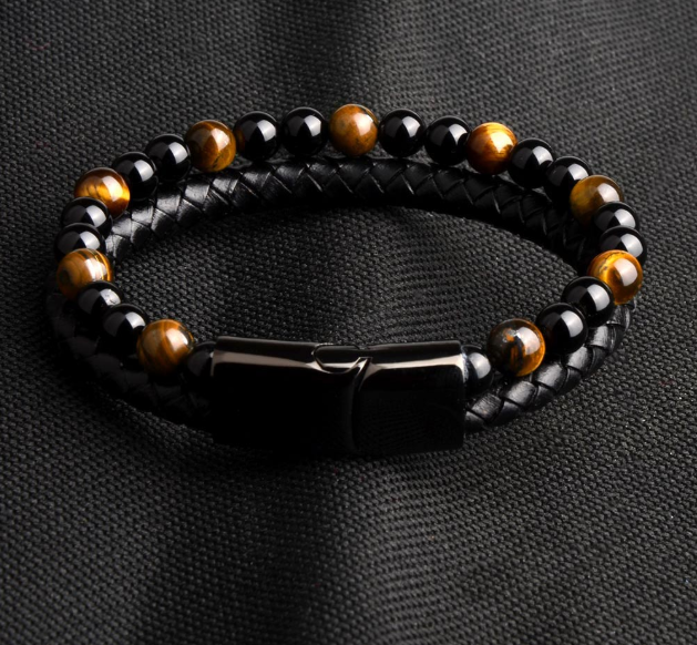 Intrepid Steel Bracelet featuring black stainless steel and genuine leather, showcasing a two-layer design with earth-toned beads.