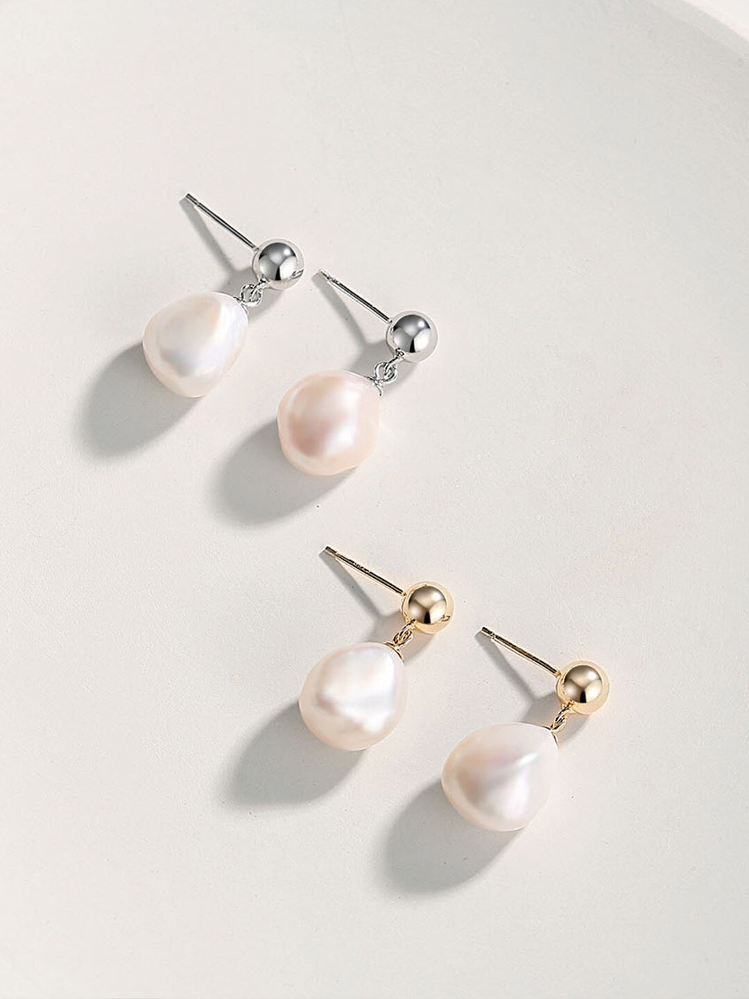 Elegant Irregular Baroque Pearls Earrings featuring unique shapes and gold vermeil setting, perfect for any occasion.