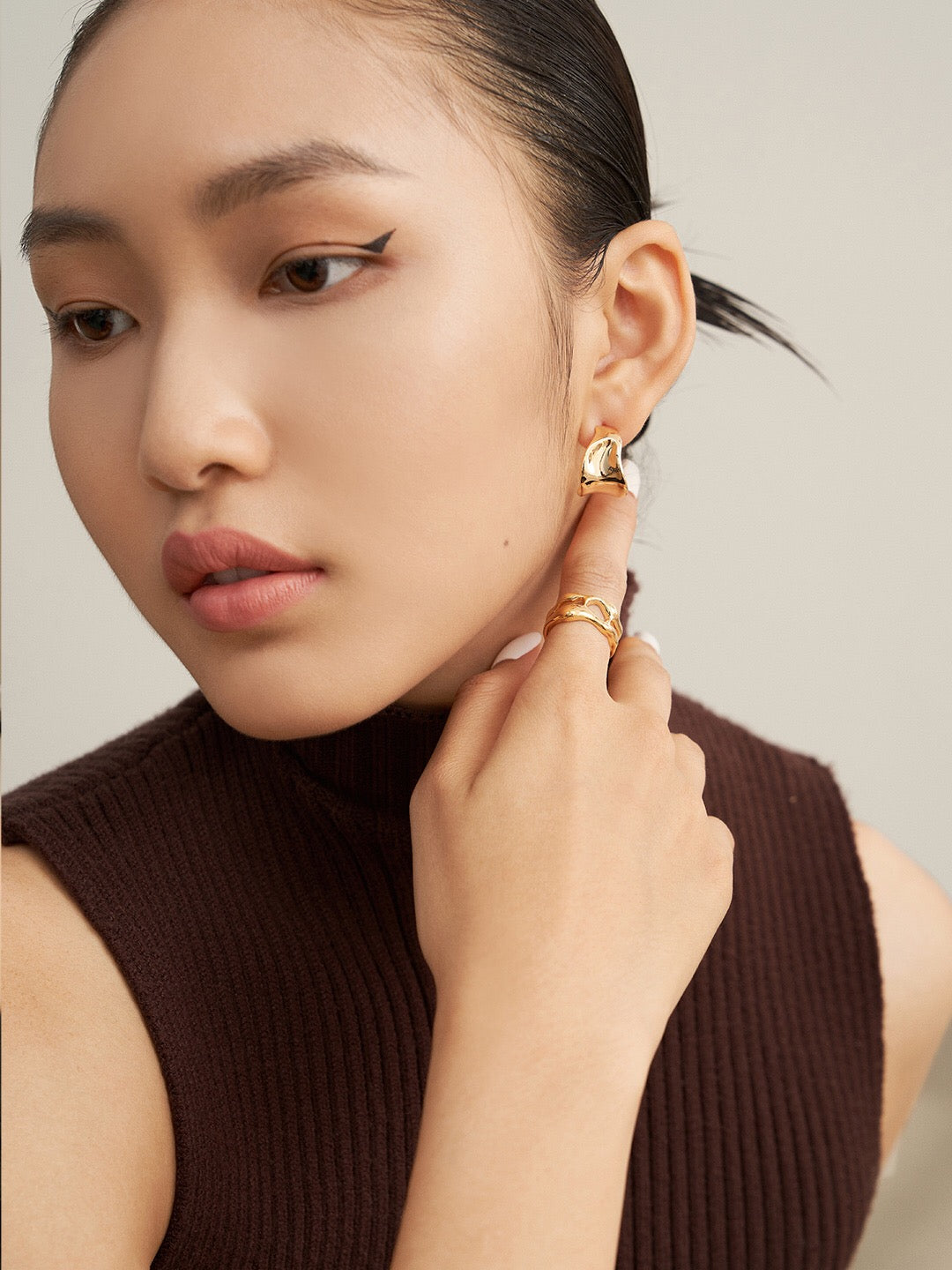 A pair of handmade Irregular Concave Convex Earrings crafted from sterling silver with a gold vermeil finish, showcasing a unique design.