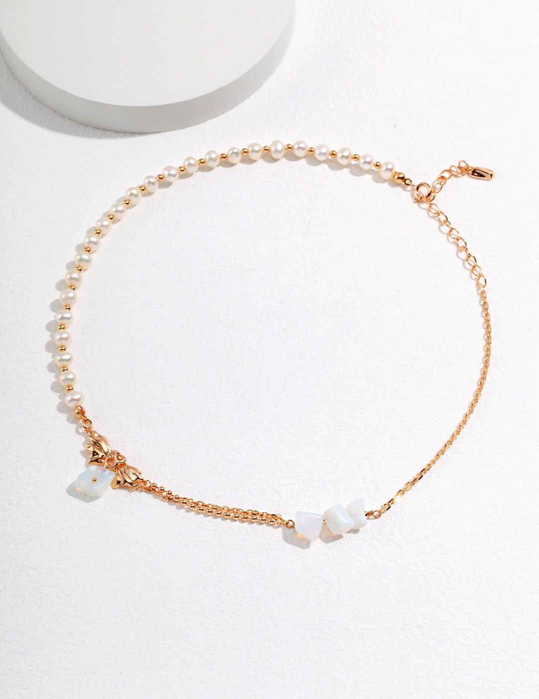 A handmade Irregular Design Opal Pearl Necklace featuring freshwater pearls and gold vermeil, showcasing its unique opal and elegant design.