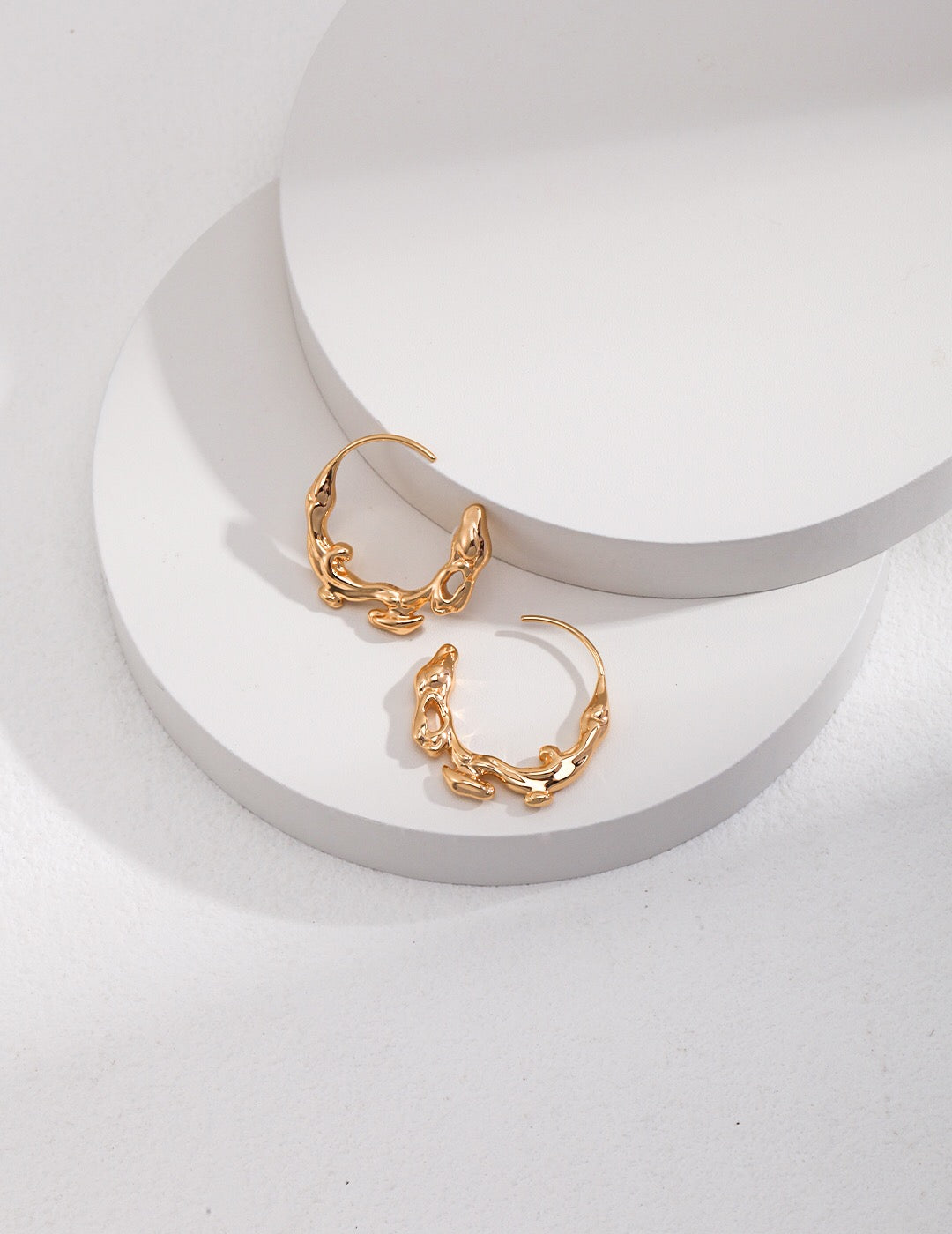 Elegant Irregular Flow Water Flow Earrings made of gold vermeil, showcasing a unique design with a fluid shape.