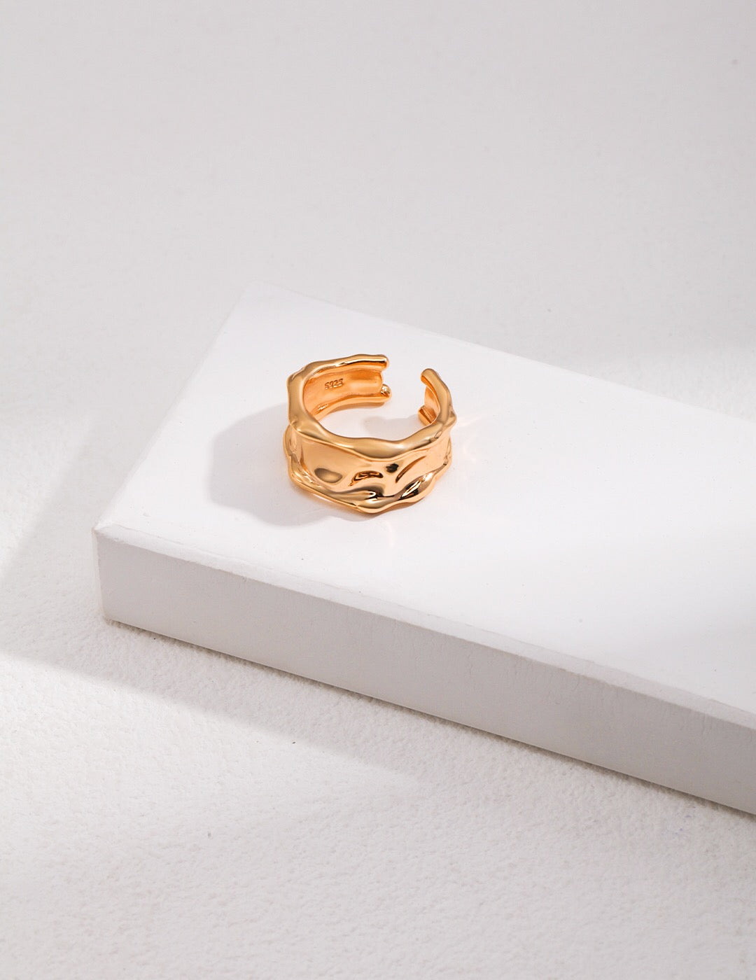 Irregular Lava Wide Face Ring made of sterling silver with gold vermeil finish, showcasing a unique textured design.