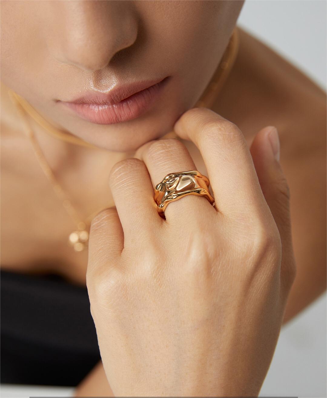 Irregular Lava Wide Face Ring made of sterling silver with gold vermeil finish, showcasing a unique textured design.