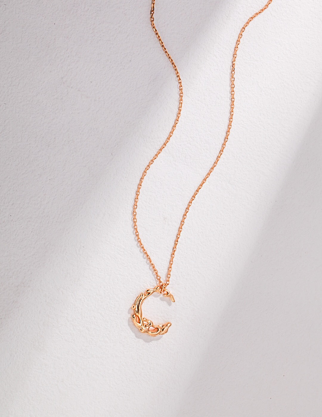 Irregular Water Flow Moon Necklace featuring freshwater pearls and gold vermeil pendant, elegantly displayed on a soft background.