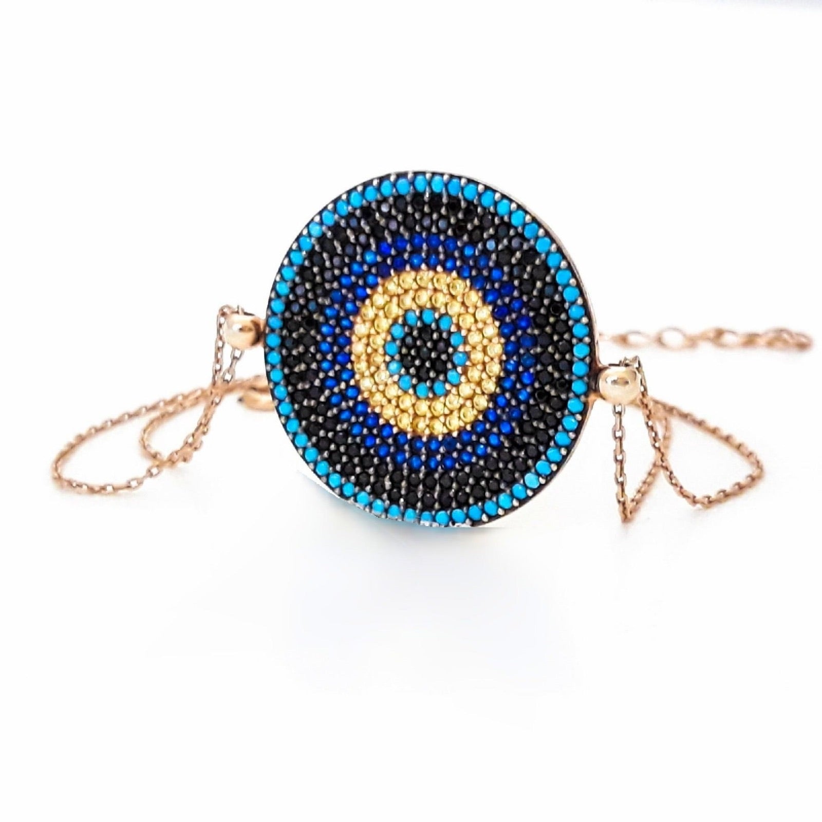 IREM Bracelet featuring vibrant cubic zirconias in yellow, blue, and black, set in 925 sterling silver with rose gold plating and a lucky evil eye charm.