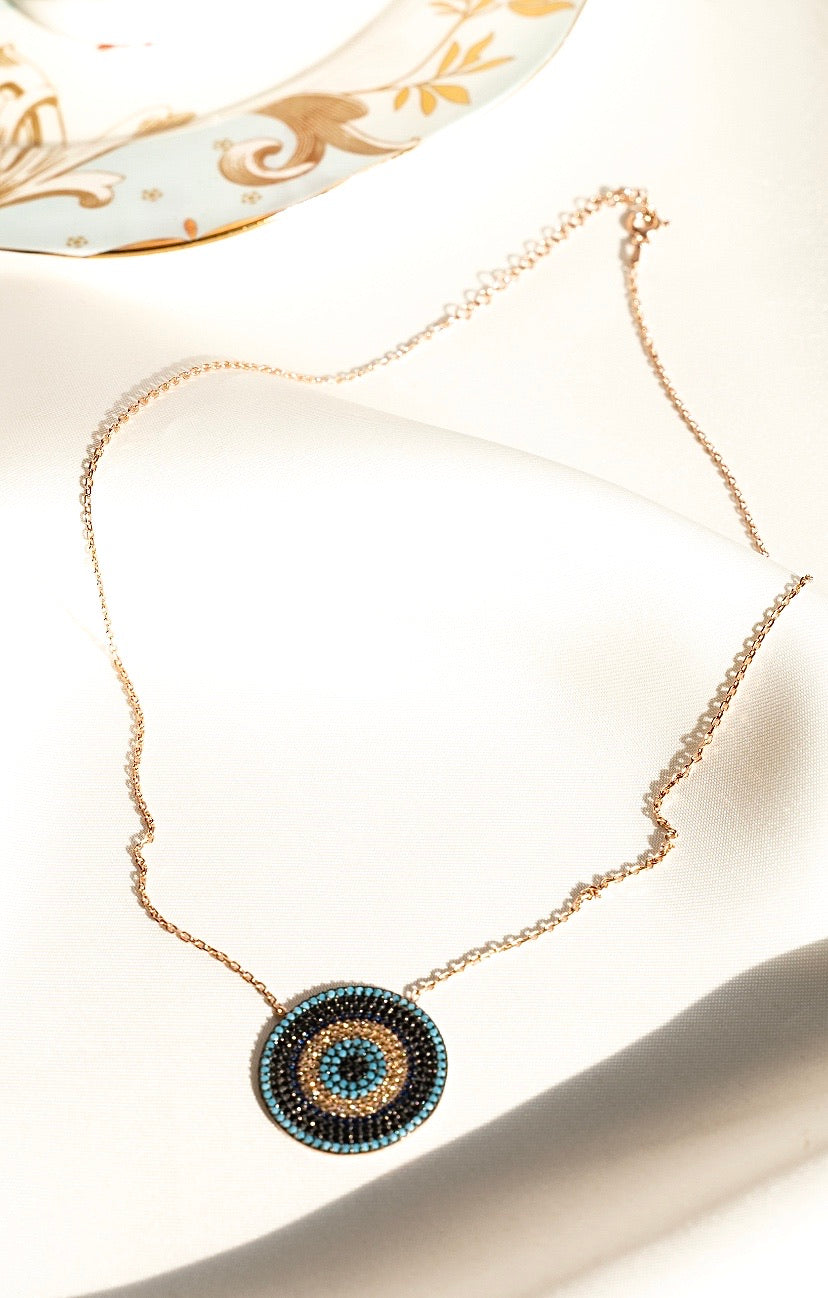 IREM Necklace featuring vibrant cubic zirconia in turquoise, yellow, and blue, crafted from 925 sterling silver with a yellow gold plating.