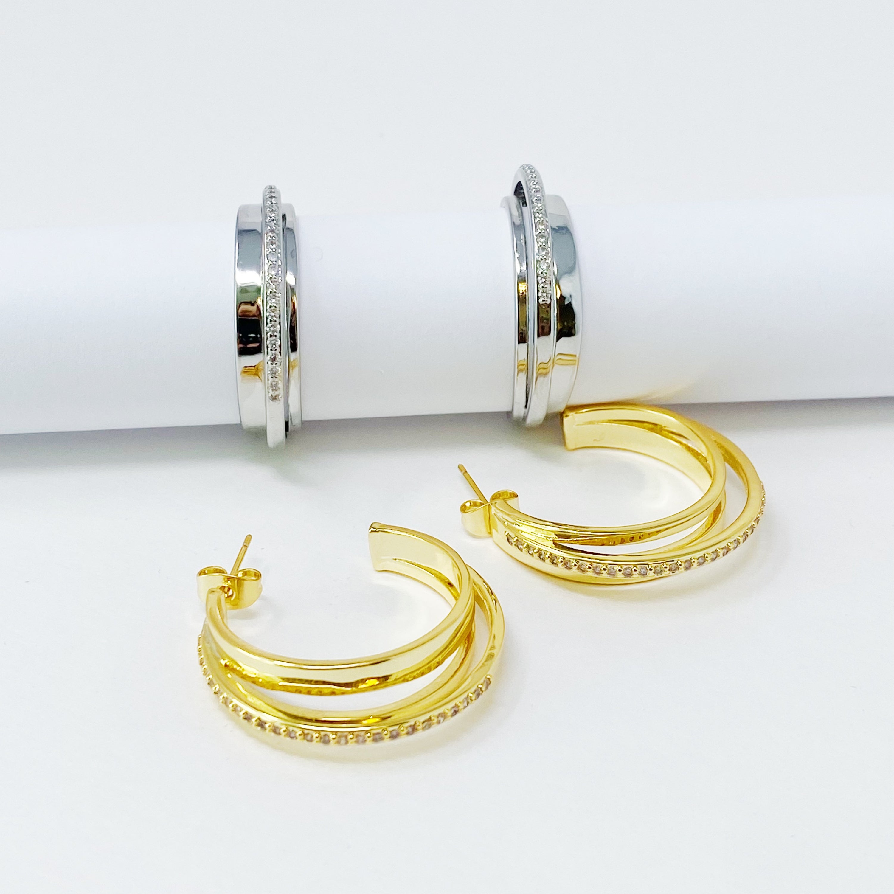 Irene Dimensional Hoop Earrings featuring three layered hoops in 18k Gold or Rhodium plating with sparkling Cubic Zirconia.