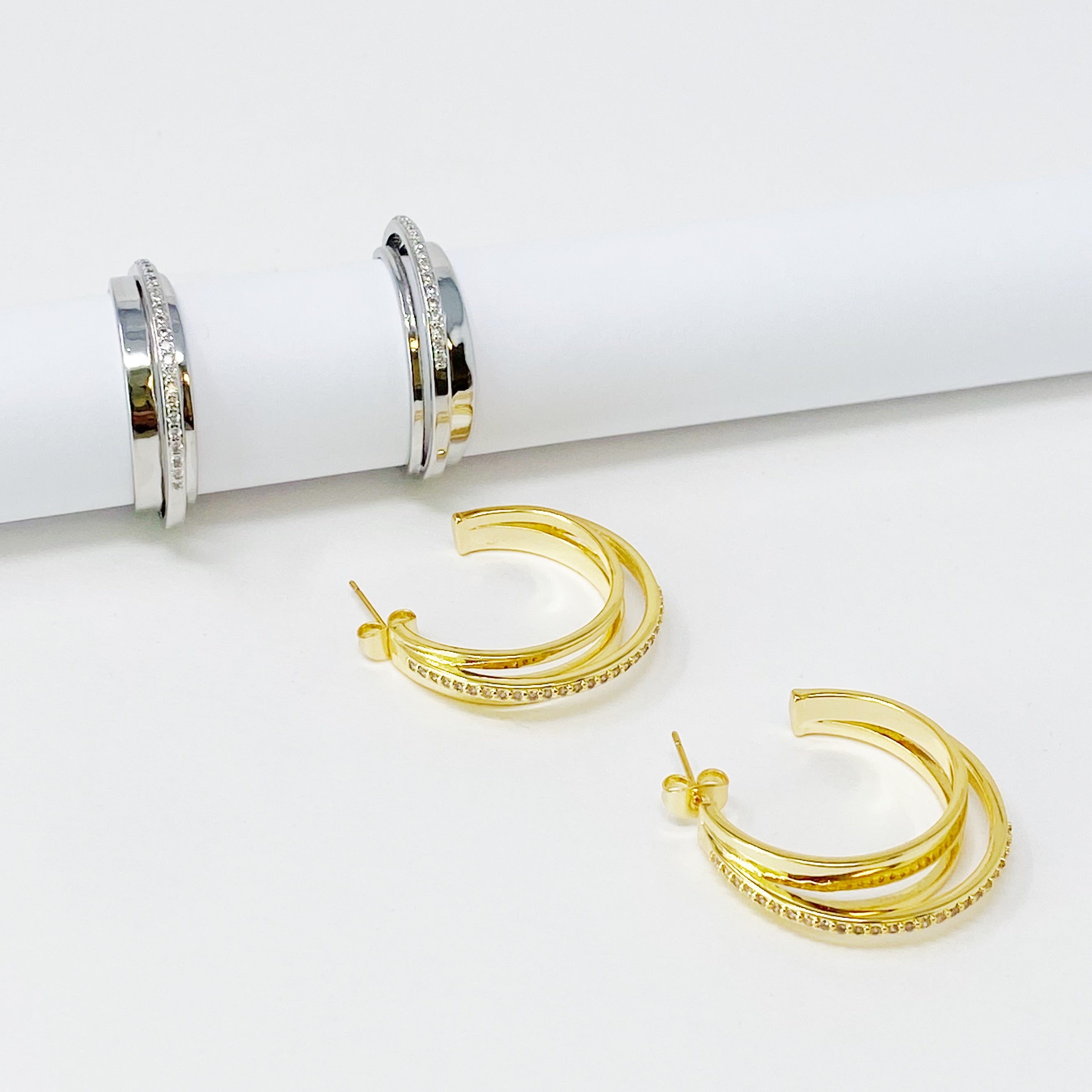 Irene Dimensional Hoop Earrings featuring three layered hoops in 18k Gold or Rhodium plating with sparkling Cubic Zirconia.