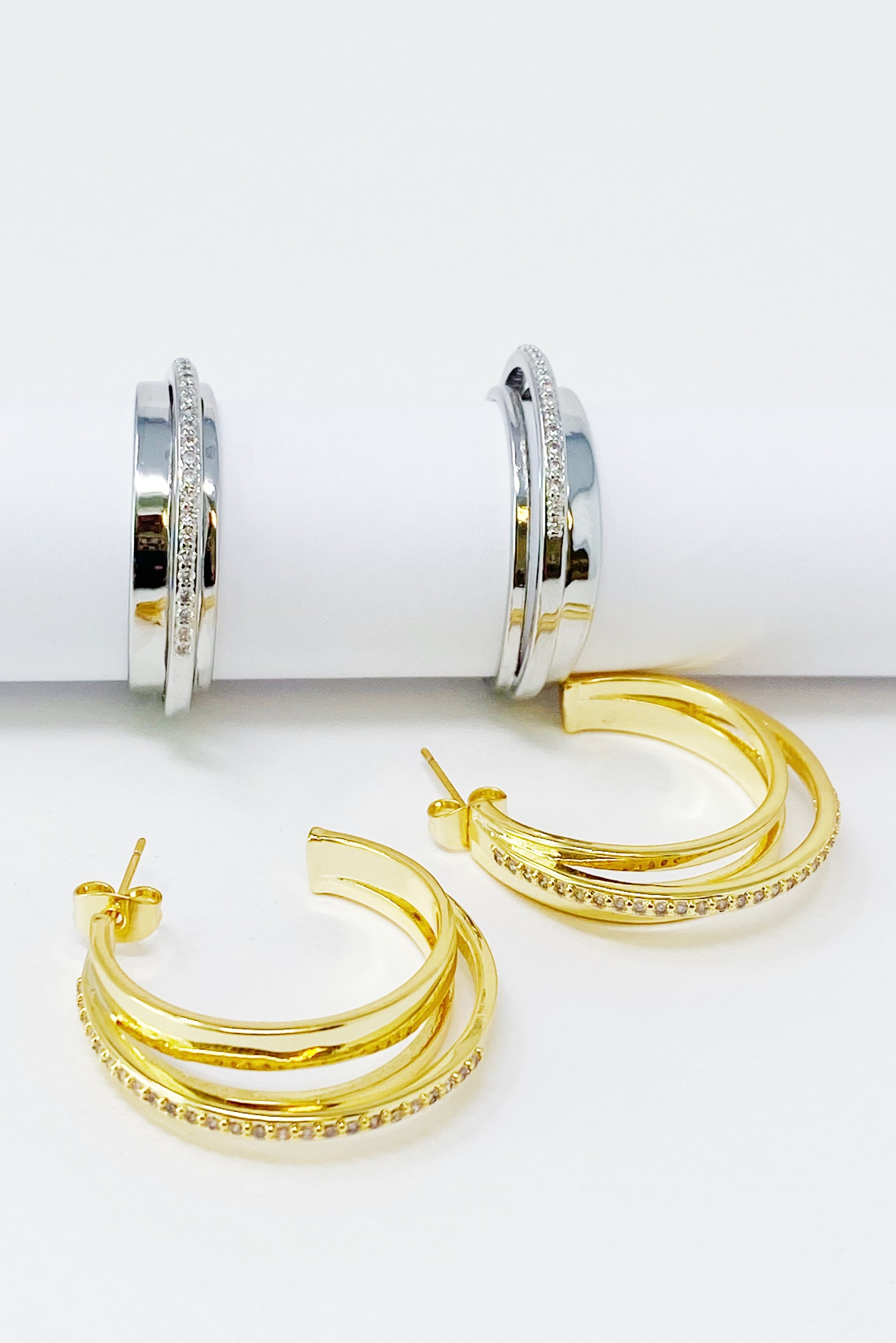 Irene Dimensional Hoop Earrings featuring three layered hoops in 18k Gold or Rhodium plating with sparkling Cubic Zirconia.