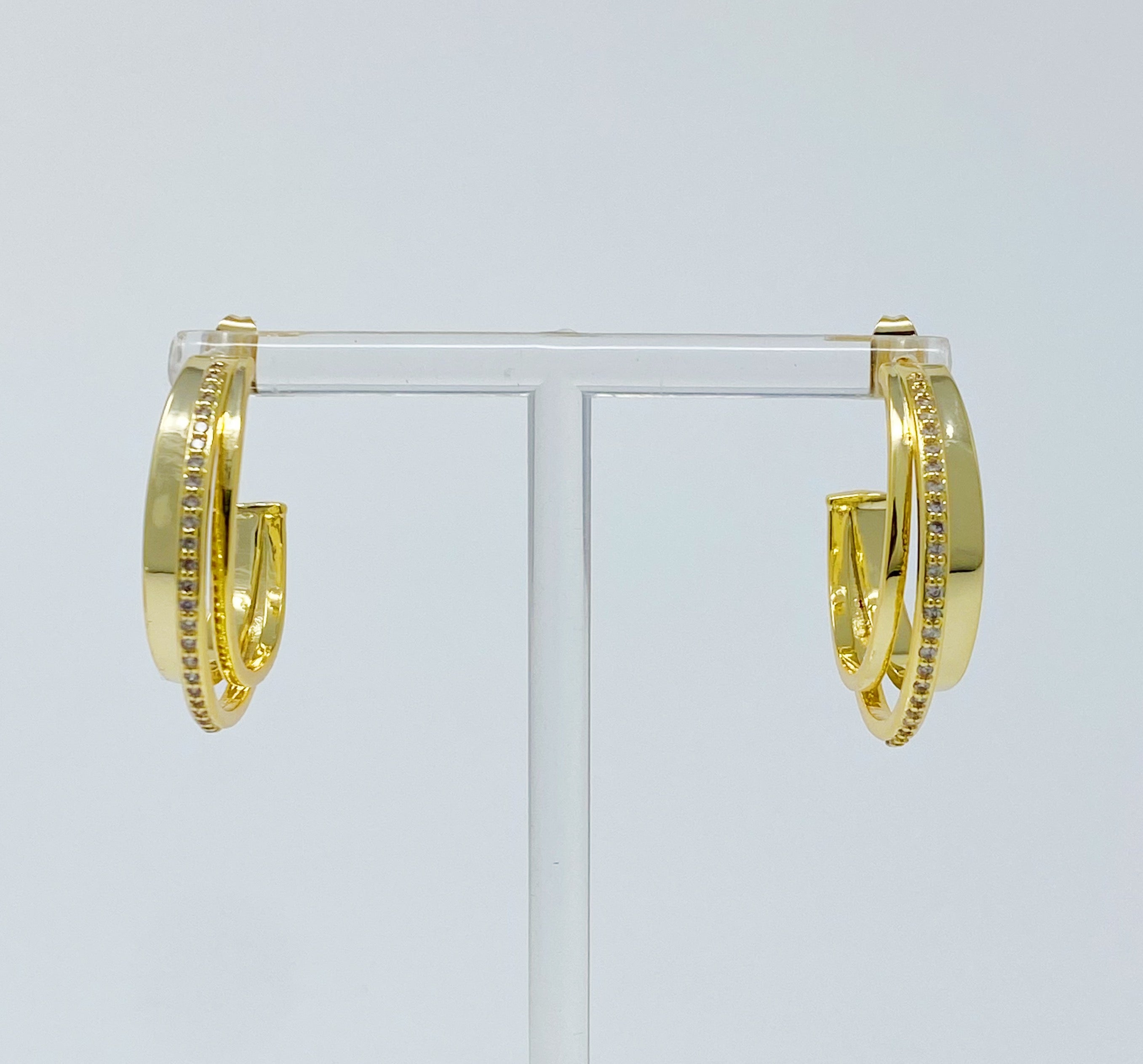 Irene Dimensional Hoop Earrings featuring three layered hoops in 18k Gold or Rhodium plating with sparkling Cubic Zirconia.