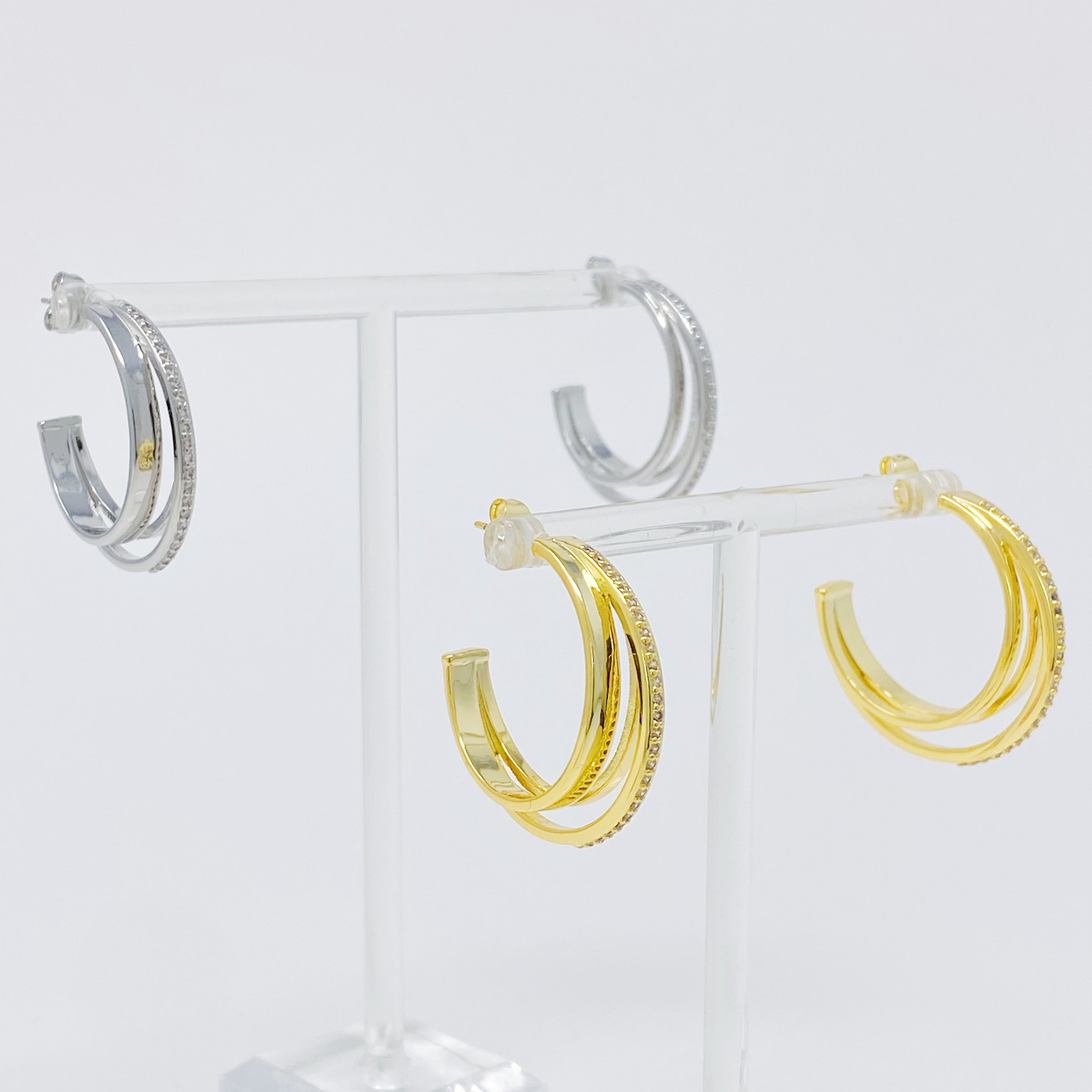 Irene Dimensional Hoop Earrings featuring three layered hoops in 18k Gold or Rhodium plating with sparkling Cubic Zirconia.