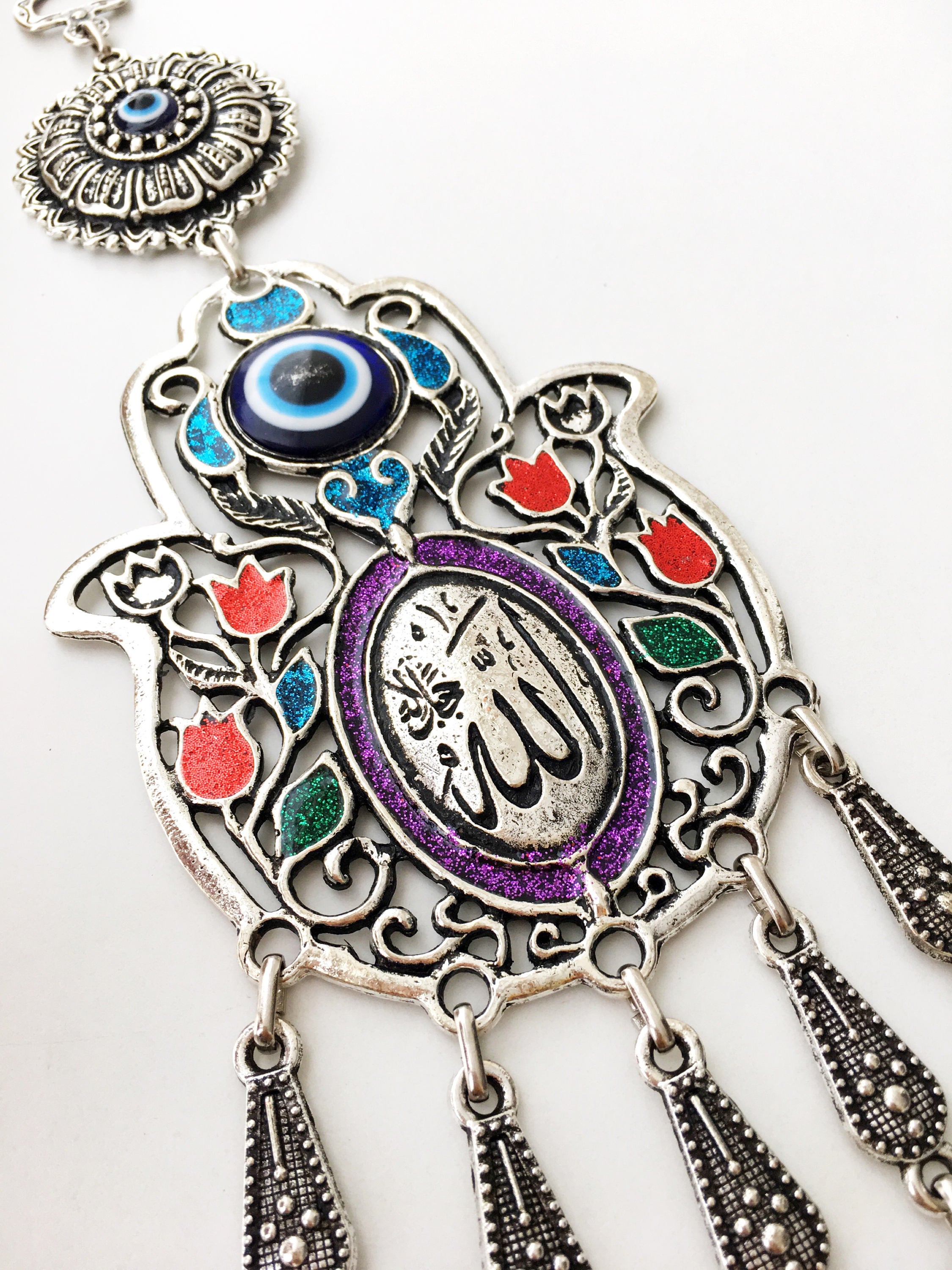 Islamic Tulip Evil Eye Wall Hanging featuring a mosaic hamsa hand and large evil eye bead, symbolizing protection and good luck.