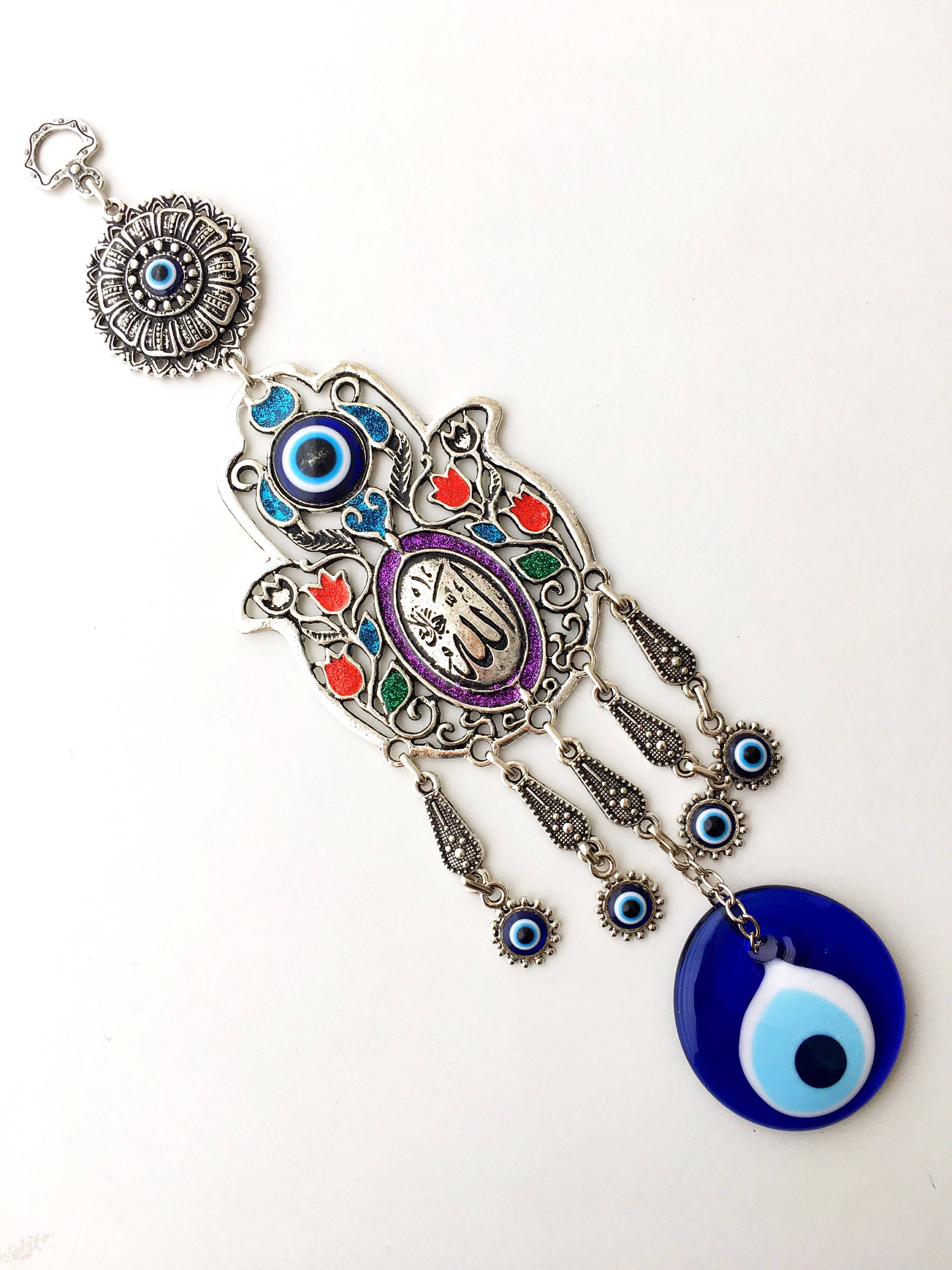 Islamic Tulip Evil Eye Wall Hanging featuring a mosaic hamsa hand and large evil eye bead, symbolizing protection and good luck.