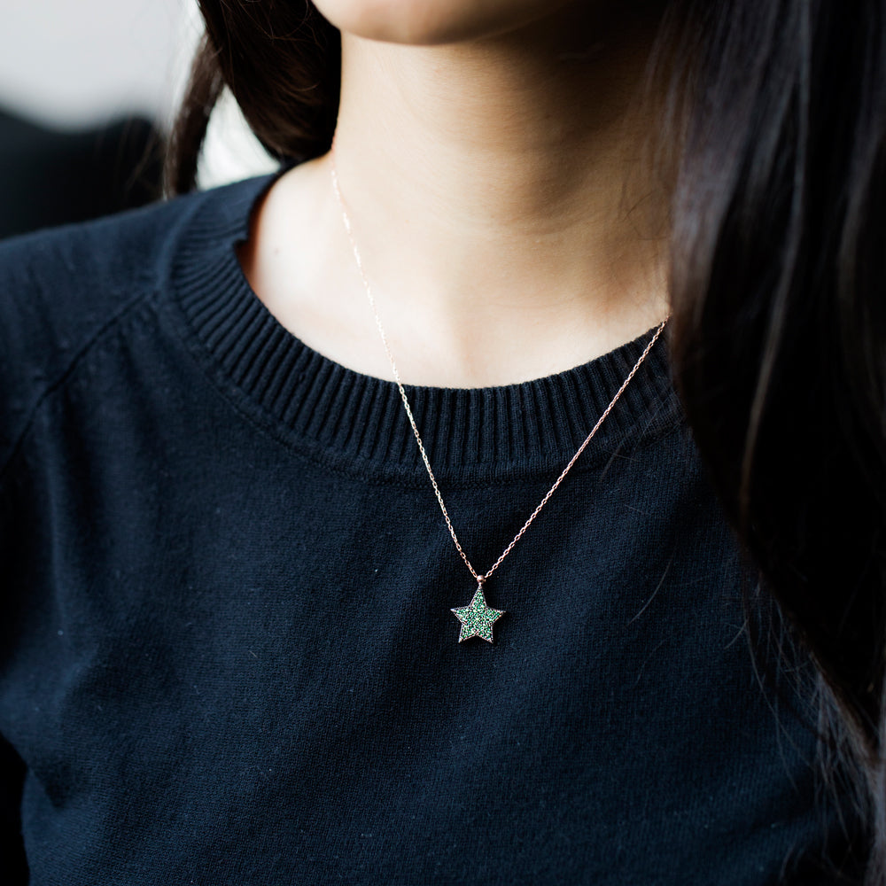 ISRA Star Necklace featuring a star pendant with cubic zirconias on a yellow gold plated sterling silver chain.