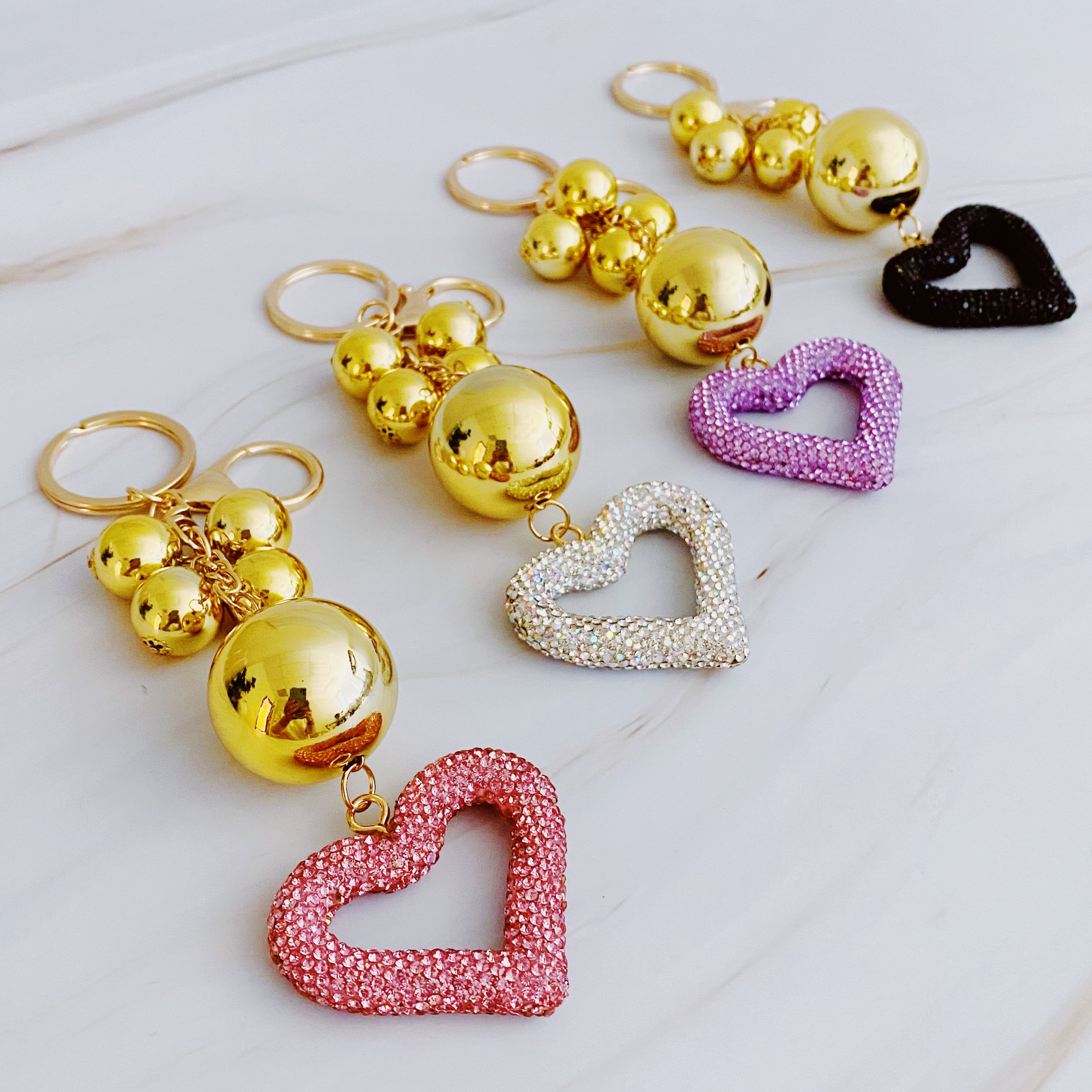 It Girl Glam Heart Bauble Key Chain featuring a stylish heart design, perfect for adding glam to bags and keys.