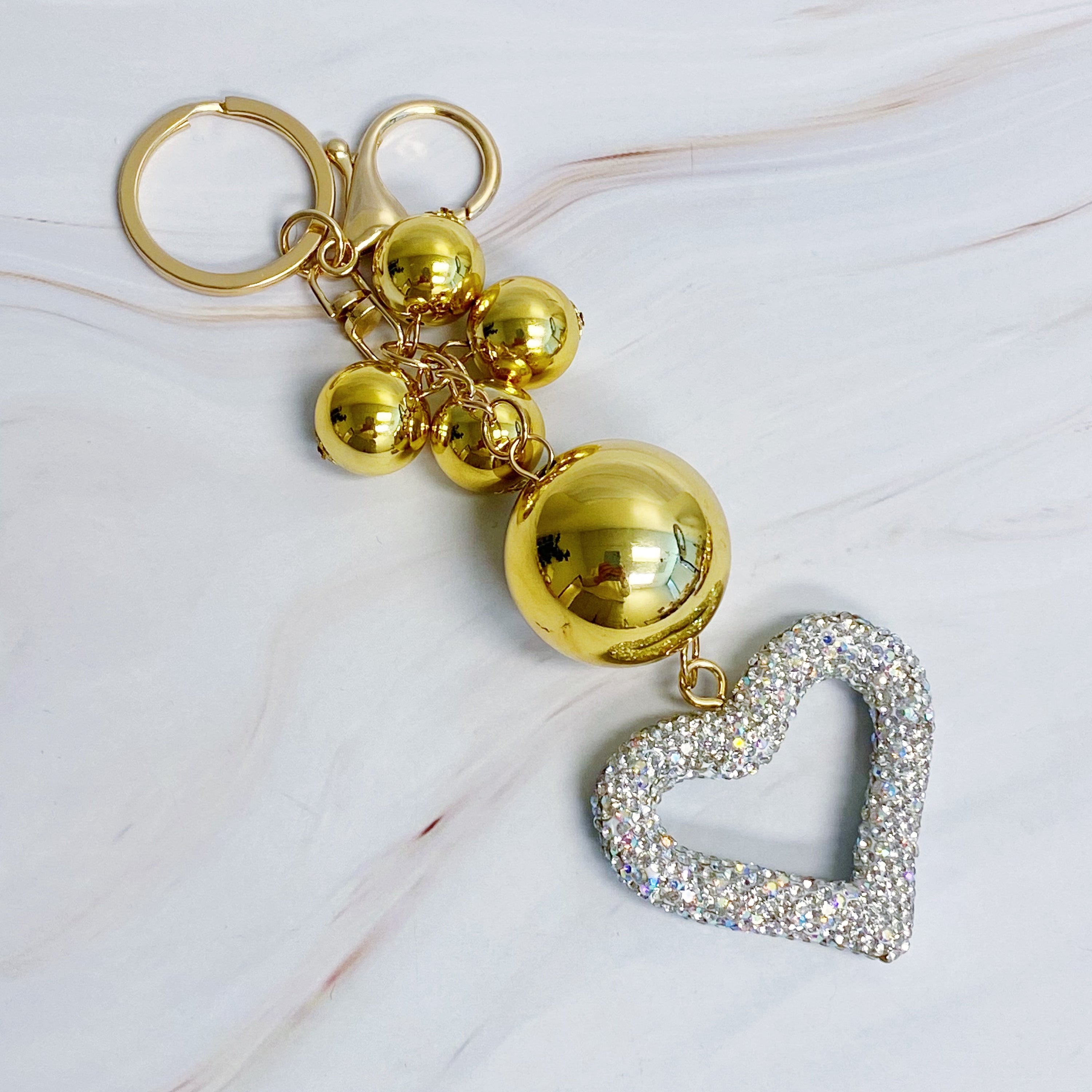 It Girl Glam Heart Bauble Key Chain featuring a stylish heart design, perfect for adding glam to bags and keys.