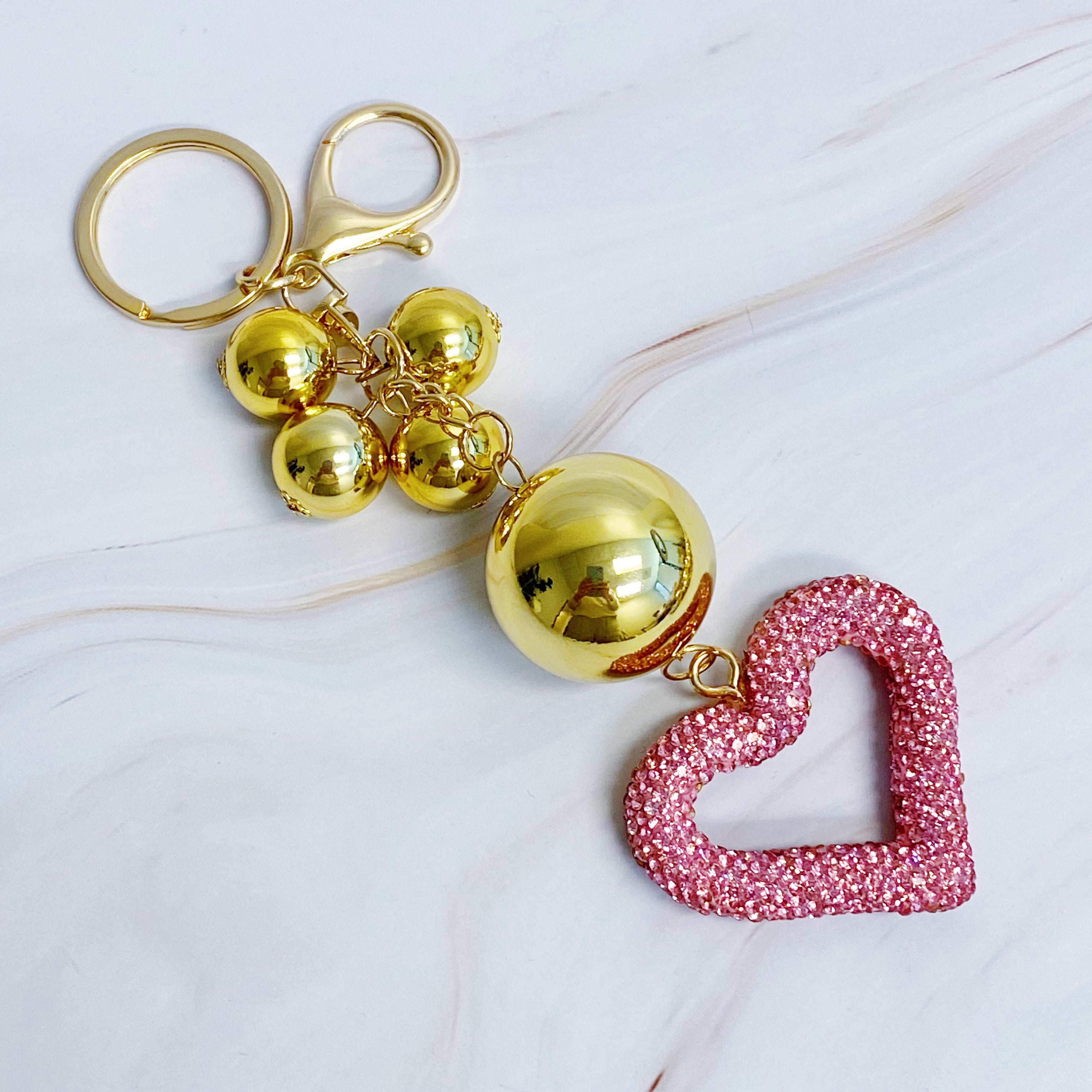 It Girl Glam Heart Bauble Key Chain featuring a stylish heart design, perfect for adding glam to bags and keys.