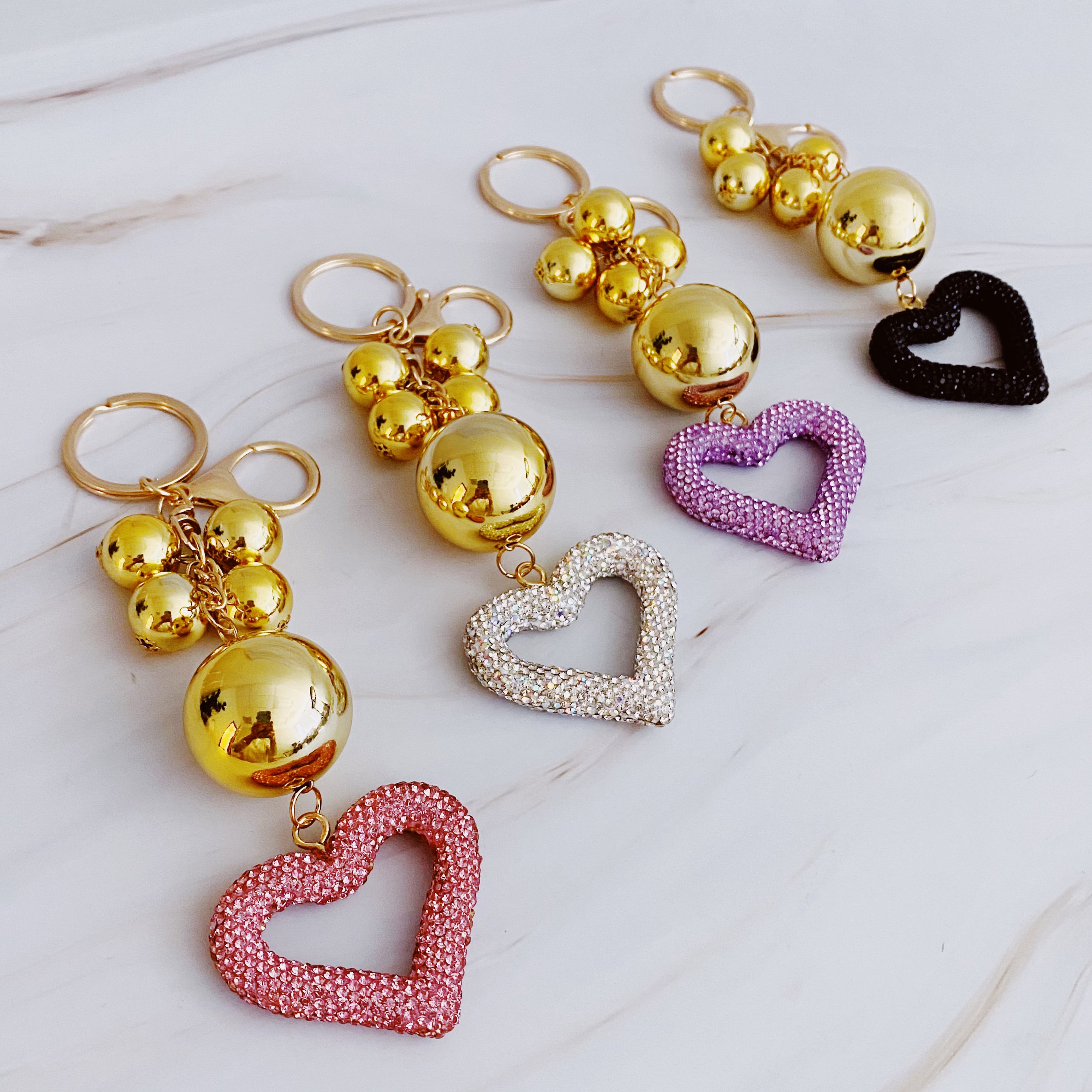 It Girl Glam Heart Bauble Key Chain featuring a stylish heart design, perfect for adding glam to bags and keys.