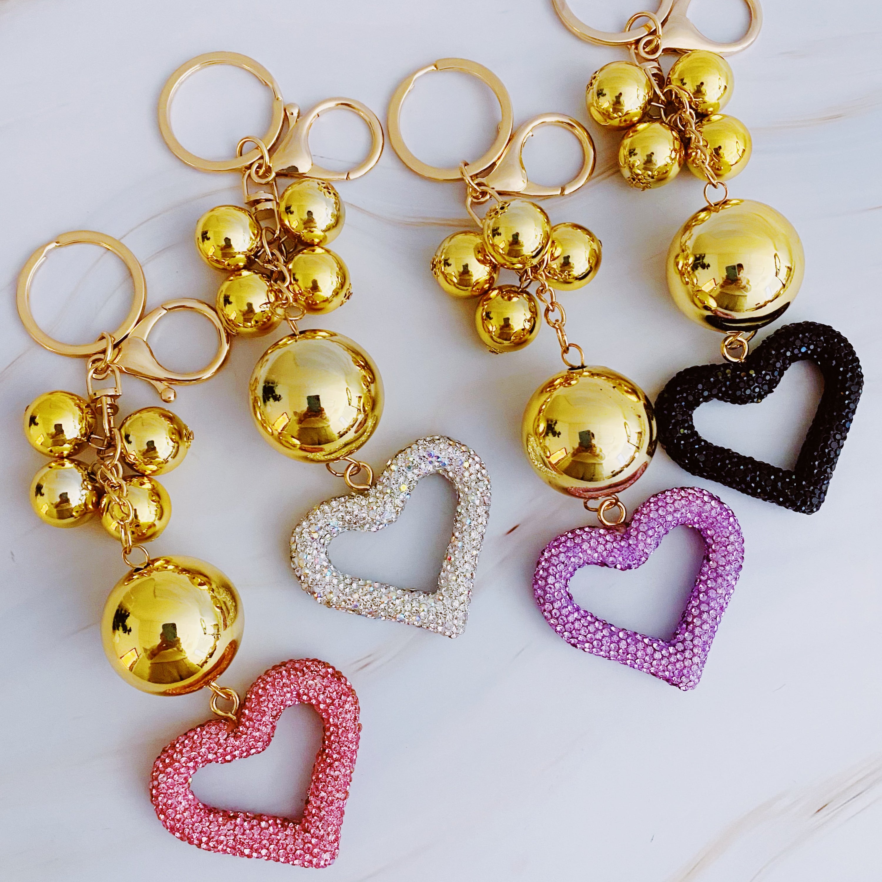 It Girl Glam Heart Bauble Key Chain featuring a stylish heart design, perfect for adding glam to bags and keys.